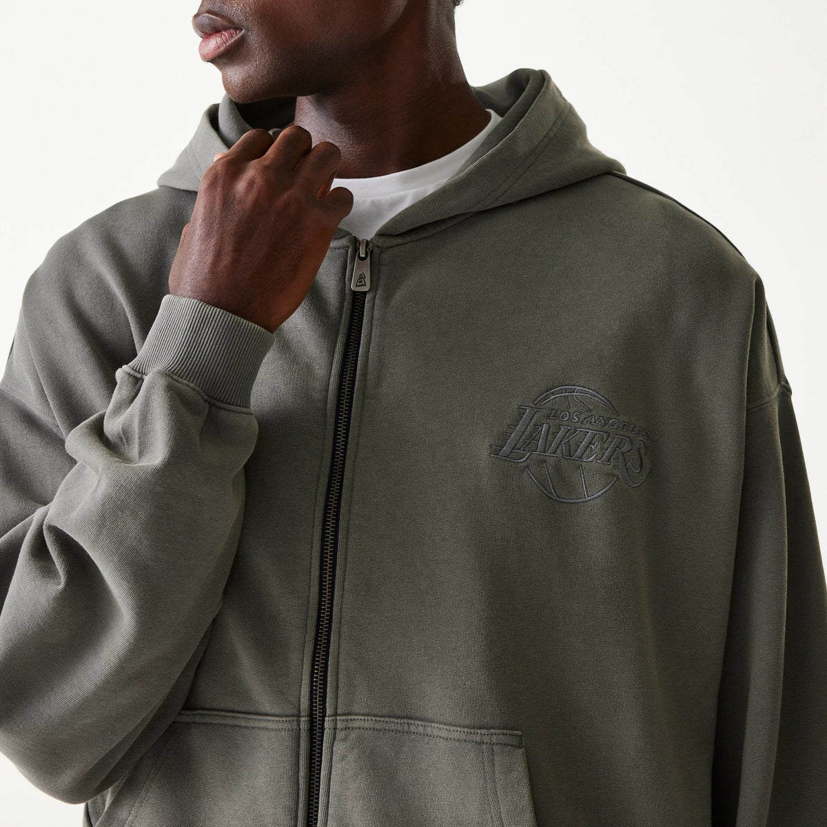New Era LA Lakers NBA Washed Grey Full Zip Hoodie, front view showing the washed grey fabric with a raised LA Lakers logo on the left chest, a full-length zip closure down the centre and ribbed cuffs on the sleeves.