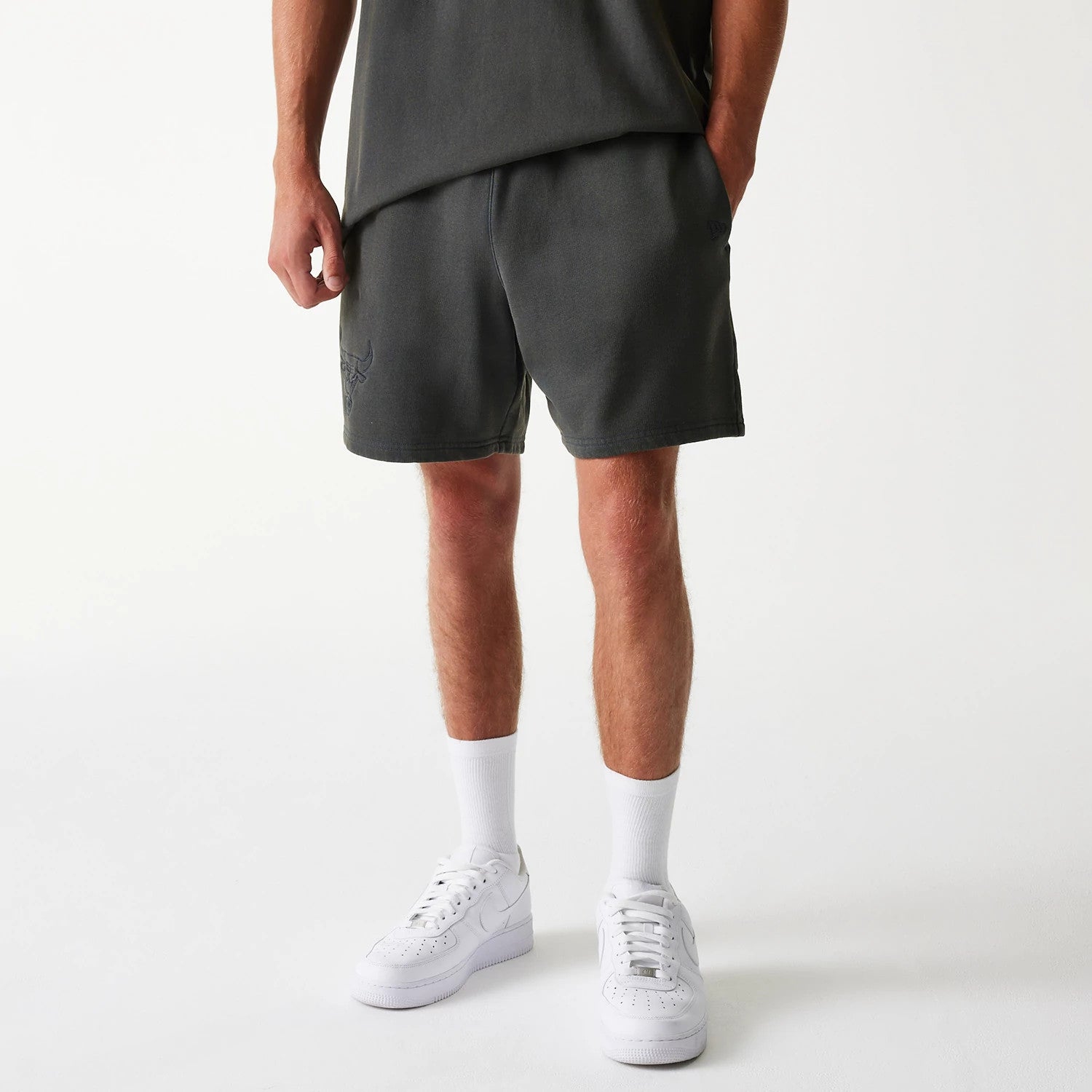The Male model is wearing Chicago Bulls NBA Washed Grey Shorts 1