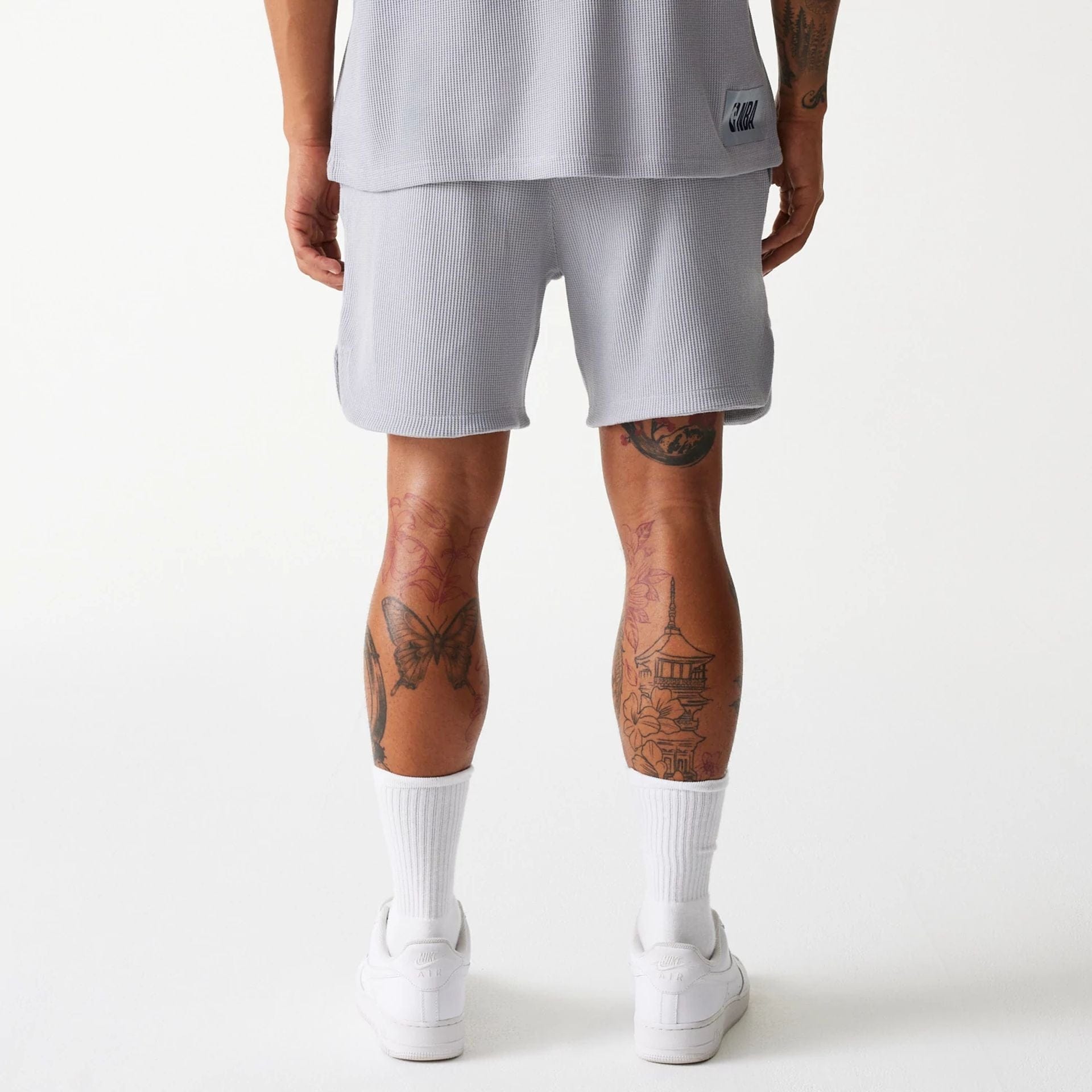The Male model is wearing LA Lakers NBA Waffle Grey Shorts 2