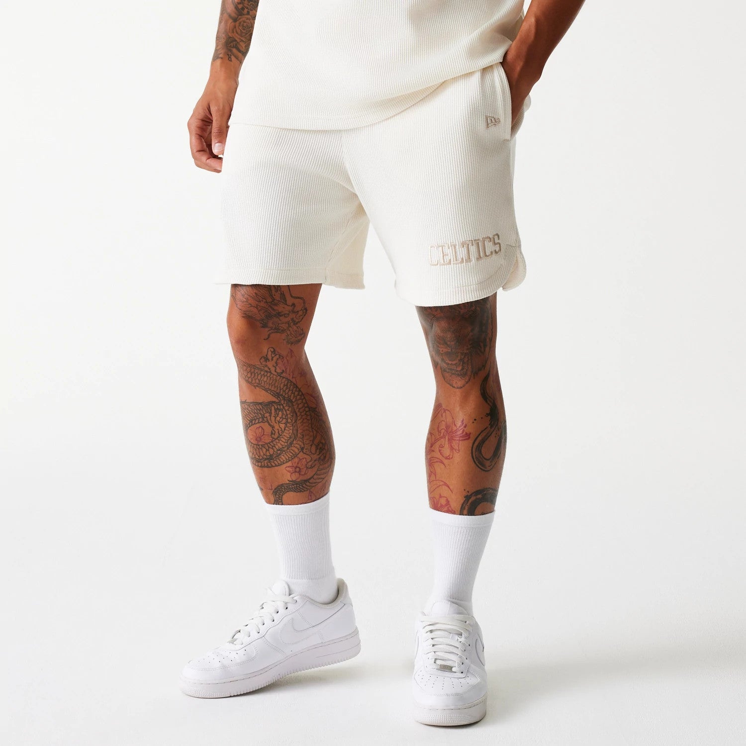 The Male model is wearing Boston Celtics NBA Waffle Open White Shorts 1