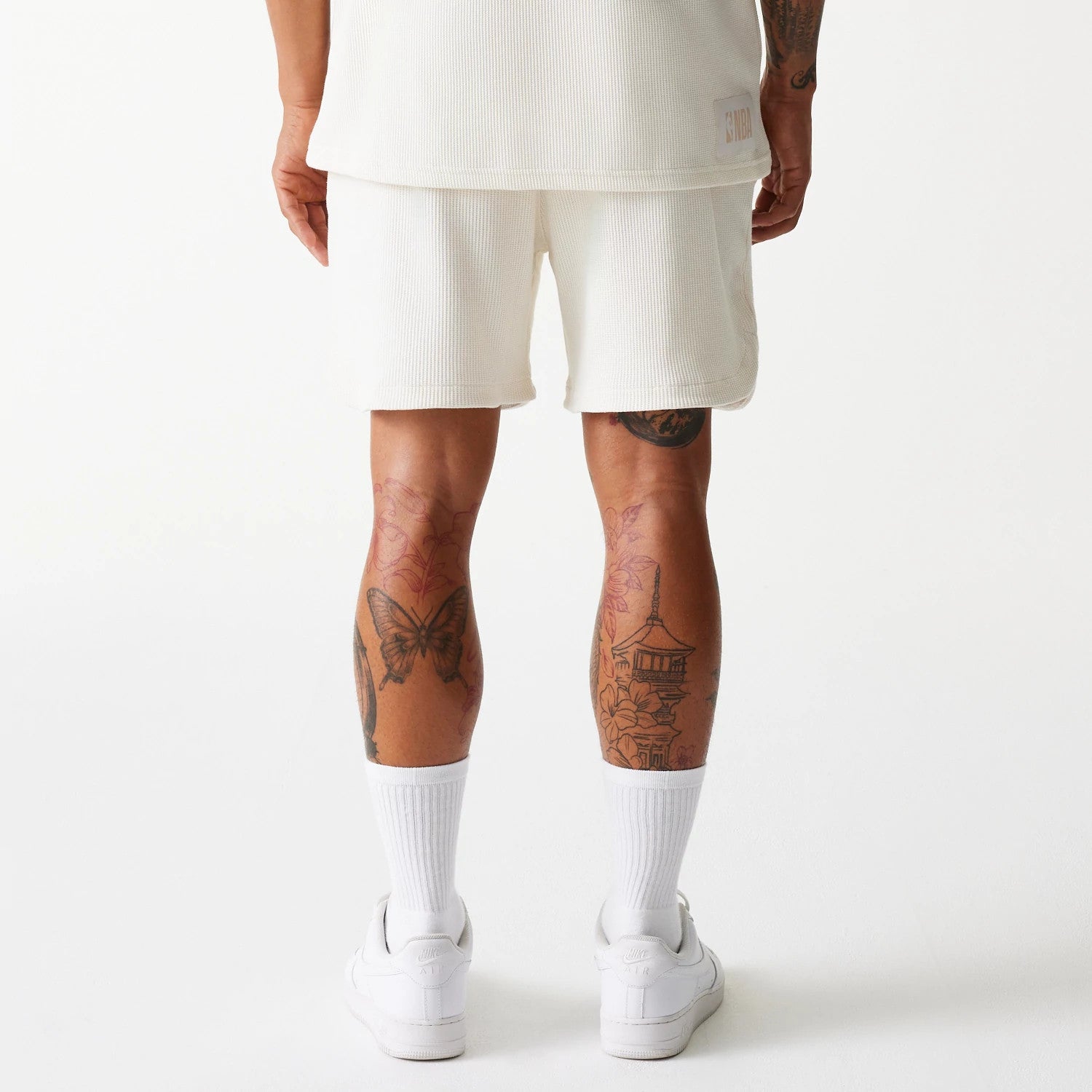 The Male model is wearing Boston Celtics NBA Waffle Open White Shorts 2