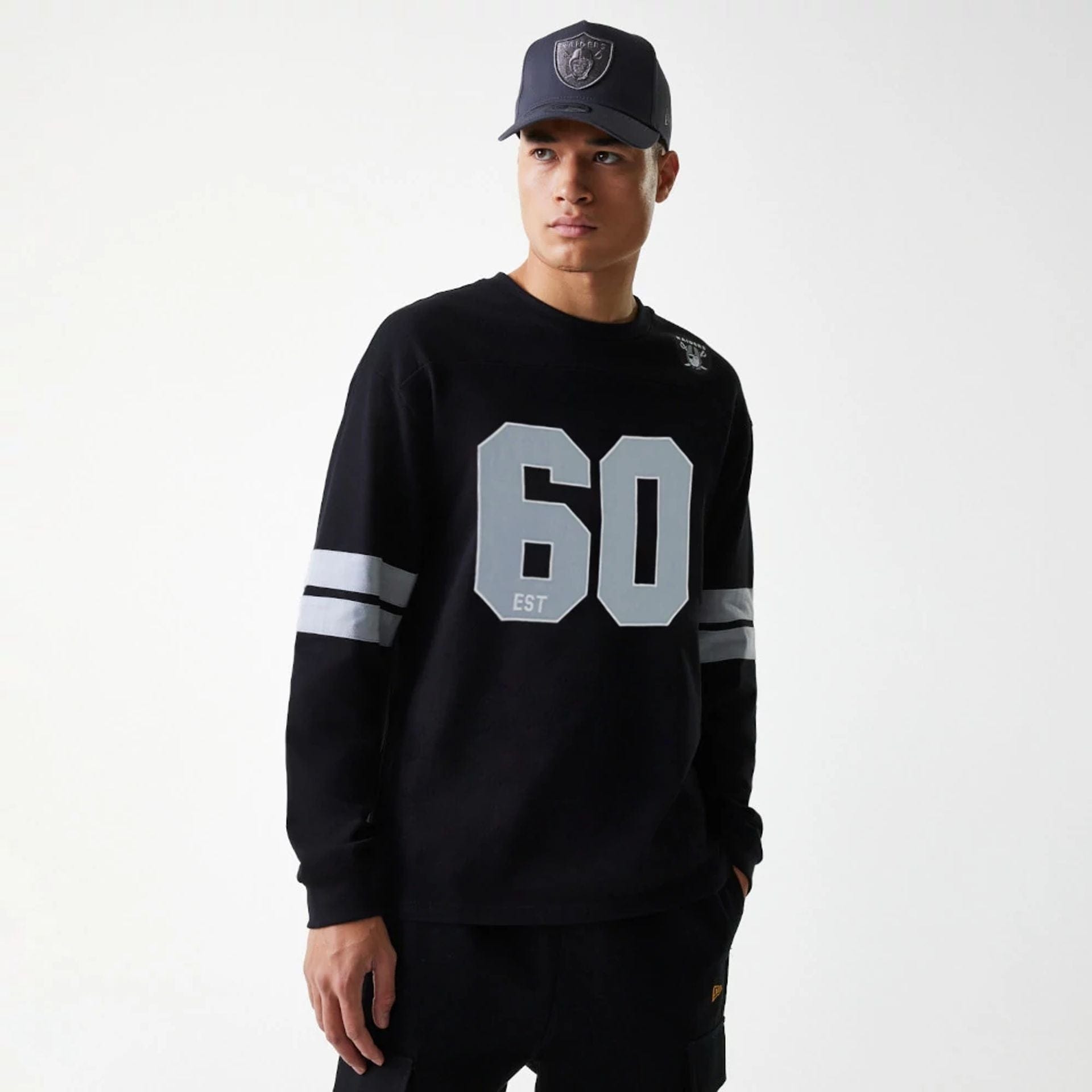 The Male model is wearing Las Vegas Raiders NFL Graphic Black Long Sleeve T-Shirt 1