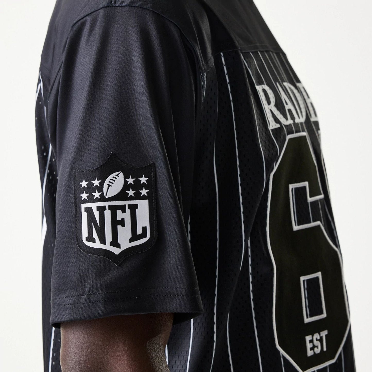 The Male model is wearing Las Vegas Raiders NFL Stripe Black Long Sleeve Jersey 7
