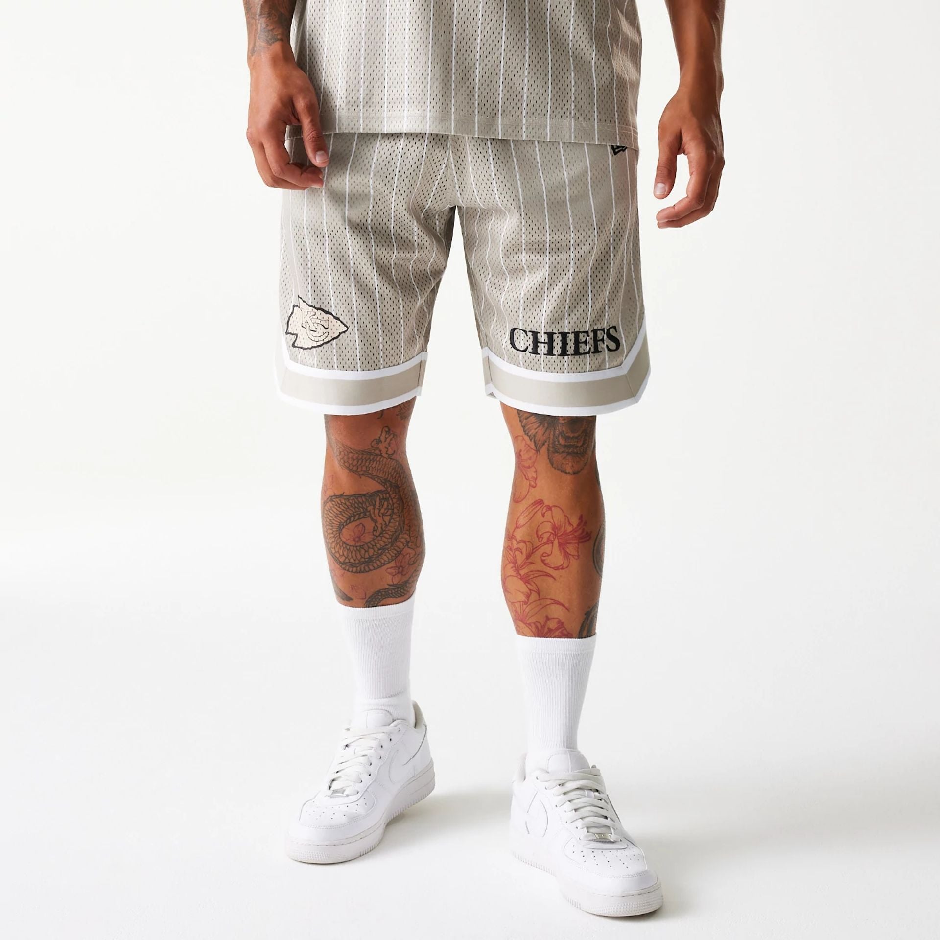 The Male model is wearing Kansas City Chiefs NFL Pinstripe Cream Shorts 1