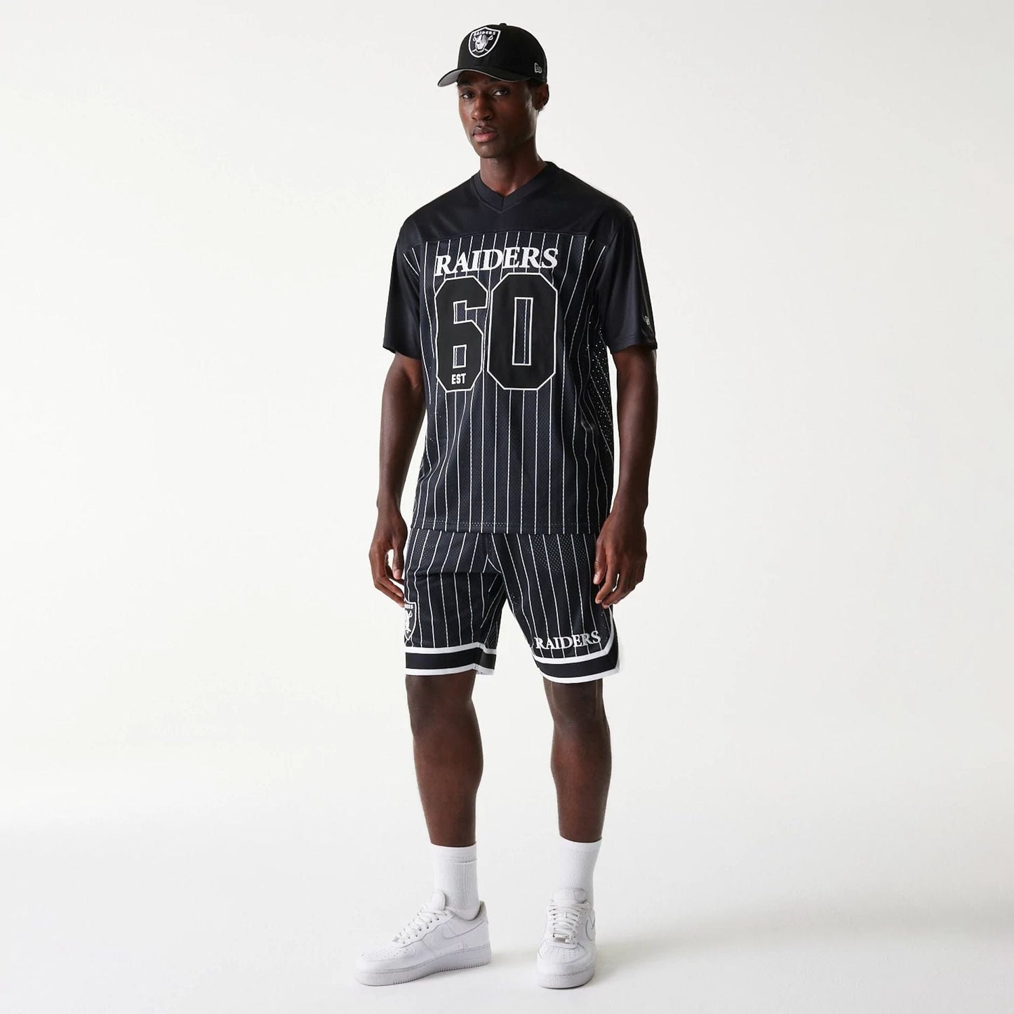 The Male model is wearing Las Vegas Raiders NFL Pinstripe Black Shorts 8