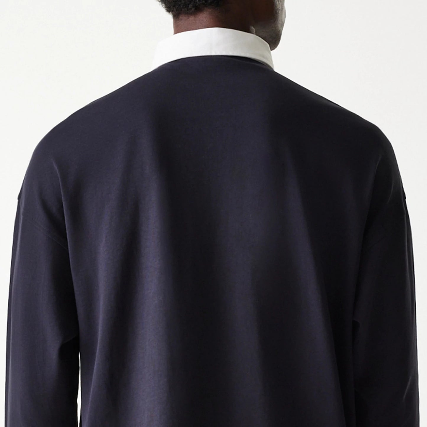 The Male model is wearing New Era Navy Oversized Rugby Shirt 7