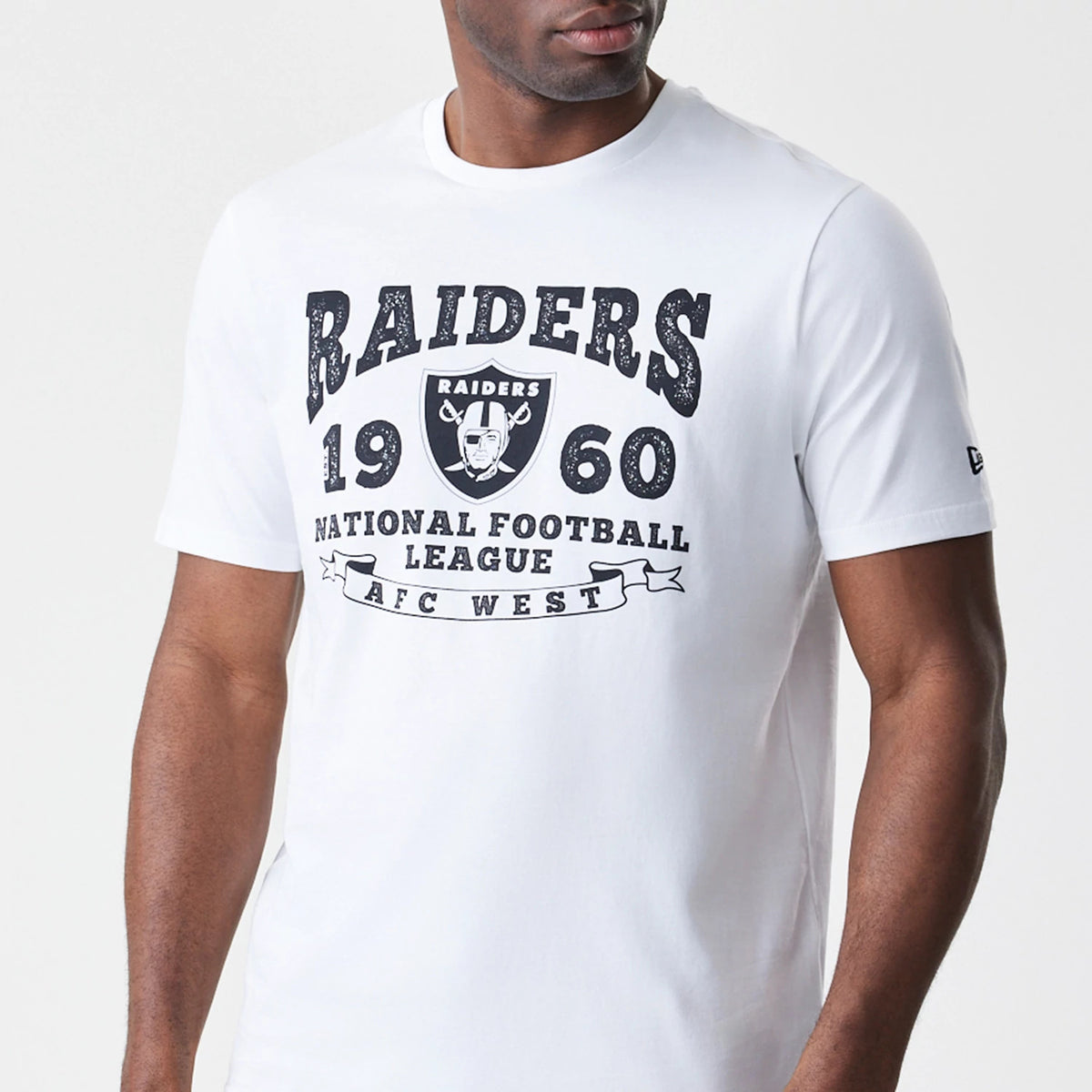 New Era Las Vegas Raiders NFL Stack Arch Logo White T-Shirt, front view showing large black Raiders logo and text design across the chest, short sleeves with a small embroidered New Era logo on the left sleeve.
