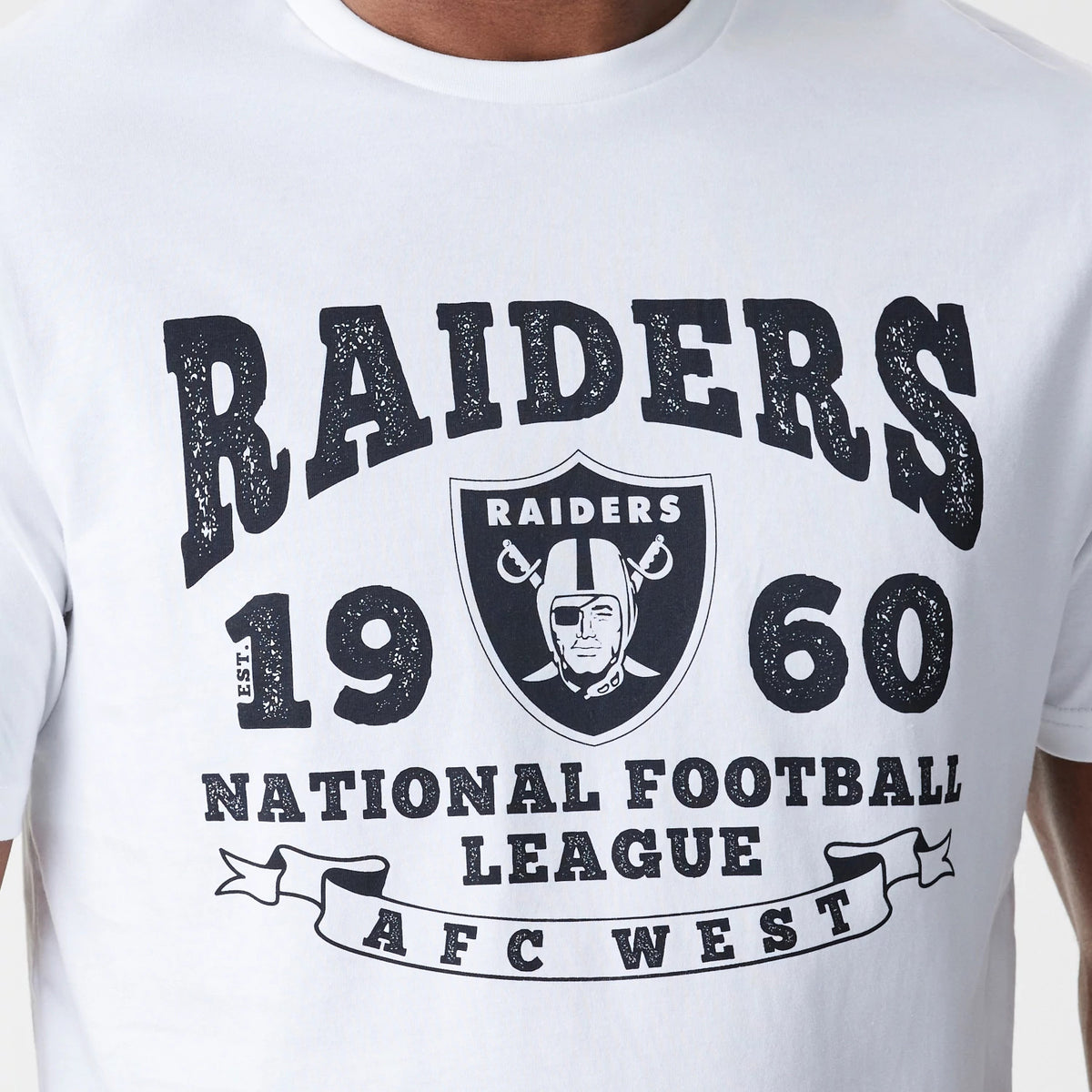 New Era Las Vegas Raiders NFL Stack Arch Logo White T-Shirt, front view showing a bold black Raiders logo with text reading RAIDERS 1960 and NATIONAL FOOTBALL LEAGUE AFC WEST across the chest of the white fabric.