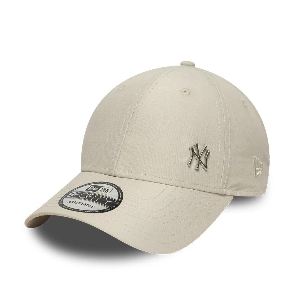 New York Yankees MLB Flawless Cream New Era 9FORTY Adjustable Cap, three-quarter view showing the raised metallic NY logo on the front panel, curved visor with a 9FORTY size sticker, and the embroidered New Era flag logo on the left side.