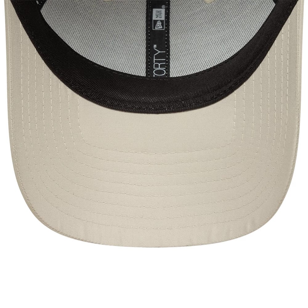 New York Yankees MLB Flawless Cream New Era 9FORTY Adjustable Cap, inside view showing black taping with the 9FORTY logo, black sweatband, and light cream undervisor with detailed stitching.