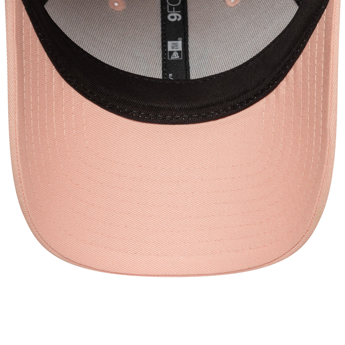 New York Yankees MLB League Essential Pastel Pink New Era 9FORTY Adjustable Cap, inside view showing the black sweatband with a central 9FORTY size sticker and grey mesh taping against the pastel pink undervisor.