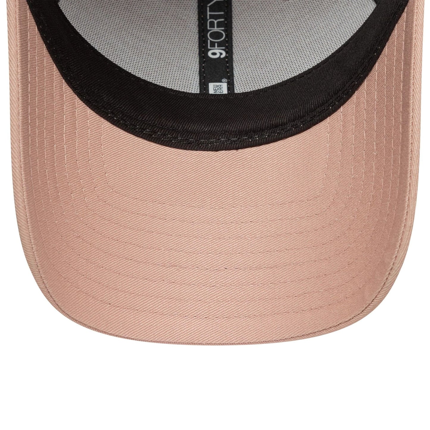 New York Yankees Womens MLB Mini Logo Pastel Pink New Era 9FORTY Adjustable Cap, inside view showing a grey sweatband with black taping and a 9FORTY size sticker on the underside of the pink visor.