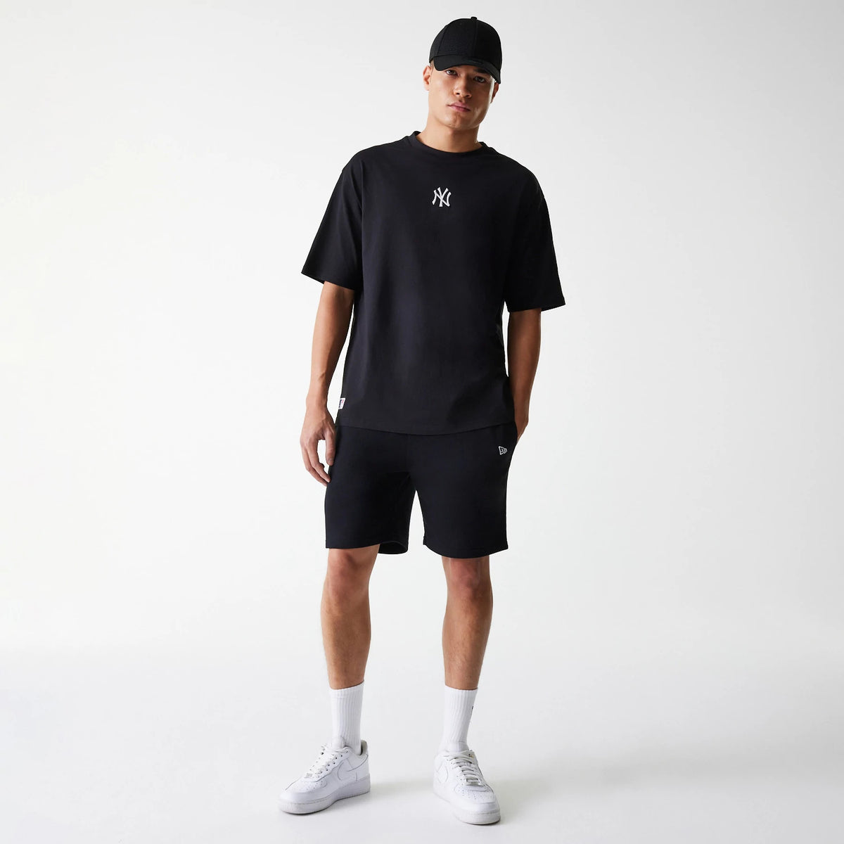 The Male model is wearing New York Yankees MLB League Essential Black Oversized T-Shirt 8