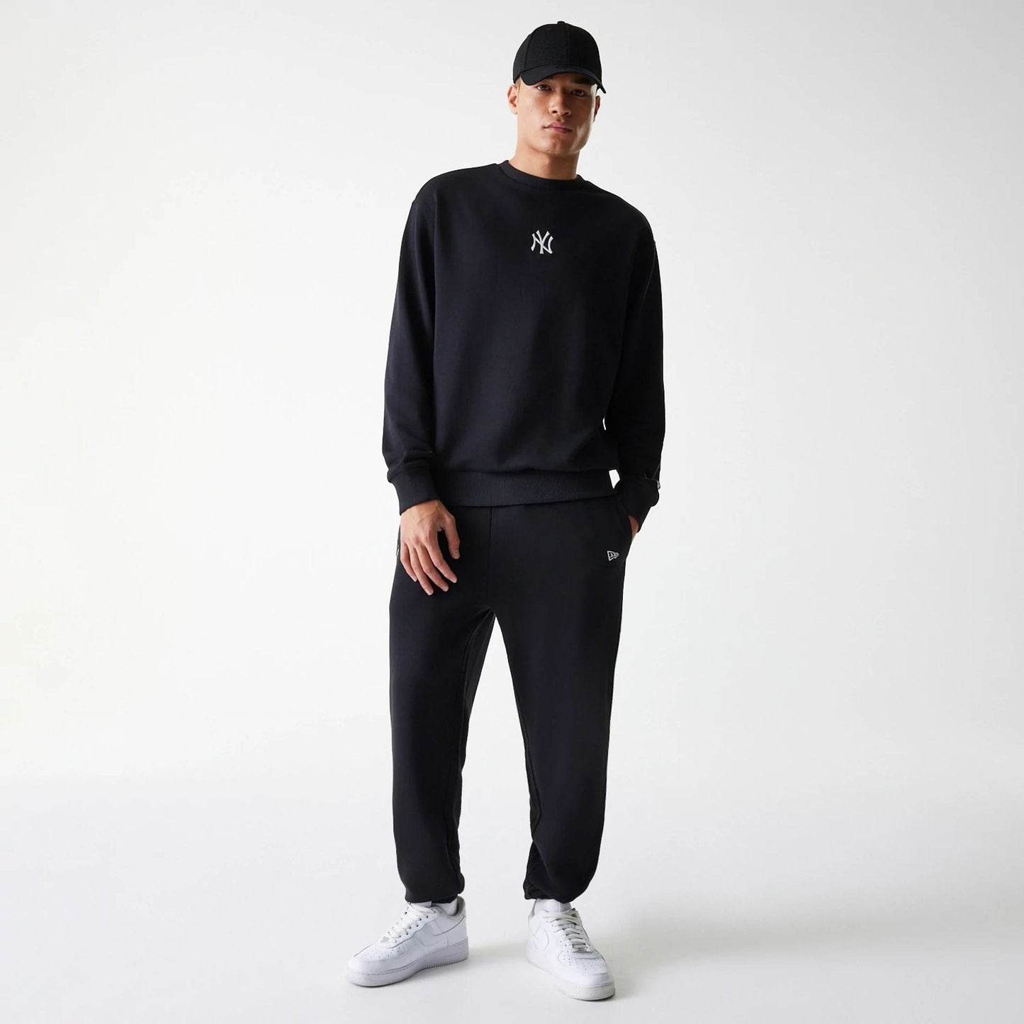The Male model is wearing New York Yankees MLB League Essential Black Crew Neck Sweater 8