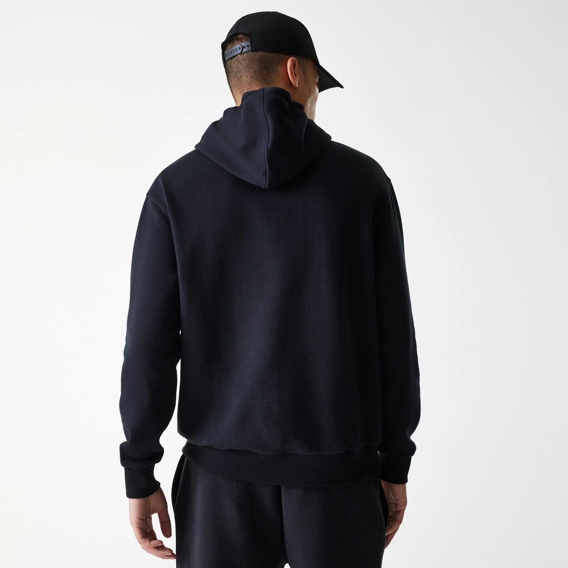 The Male model is wearing New York Yankees MLB League Essential Midi Black Oversized Pullover Hoodie 2