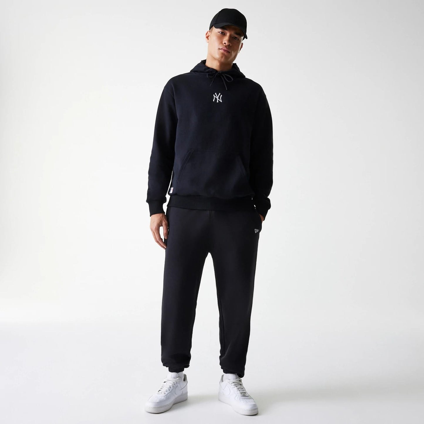 The Male model is wearing New York Yankees MLB League Essential Black Joggers 8