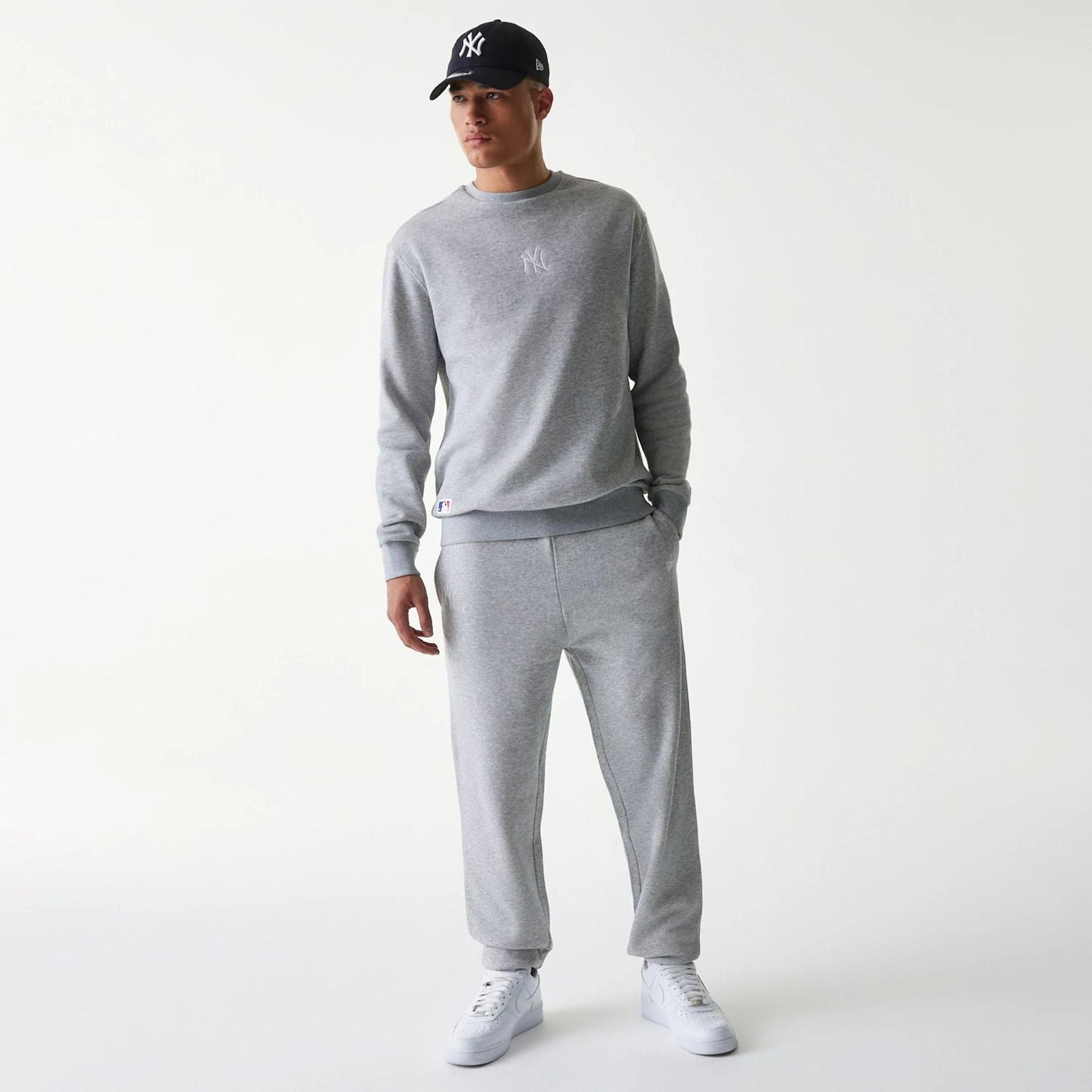 The Male model is wearing New York Yankees MLB League Essential Grey Joggers 8