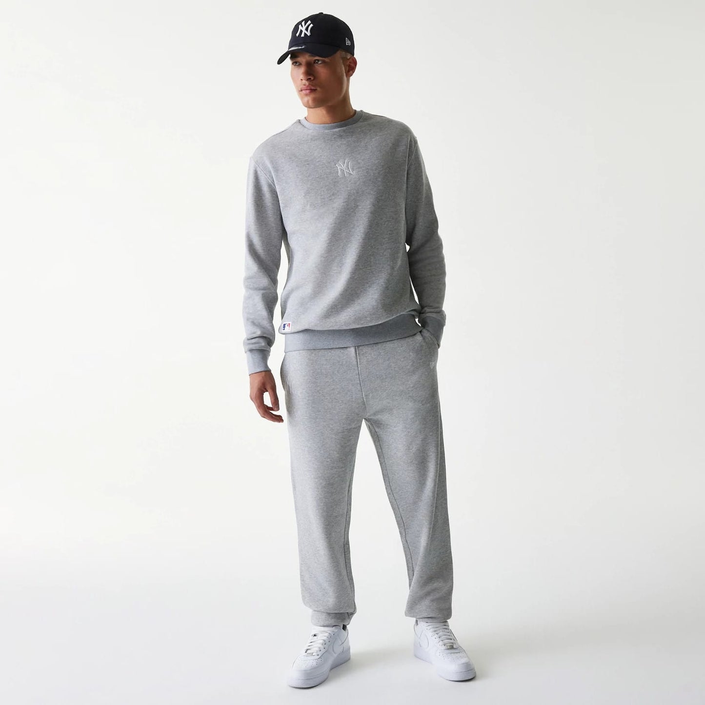 The Male model is wearing New York Yankees MLB League Essential Grey Joggers 8