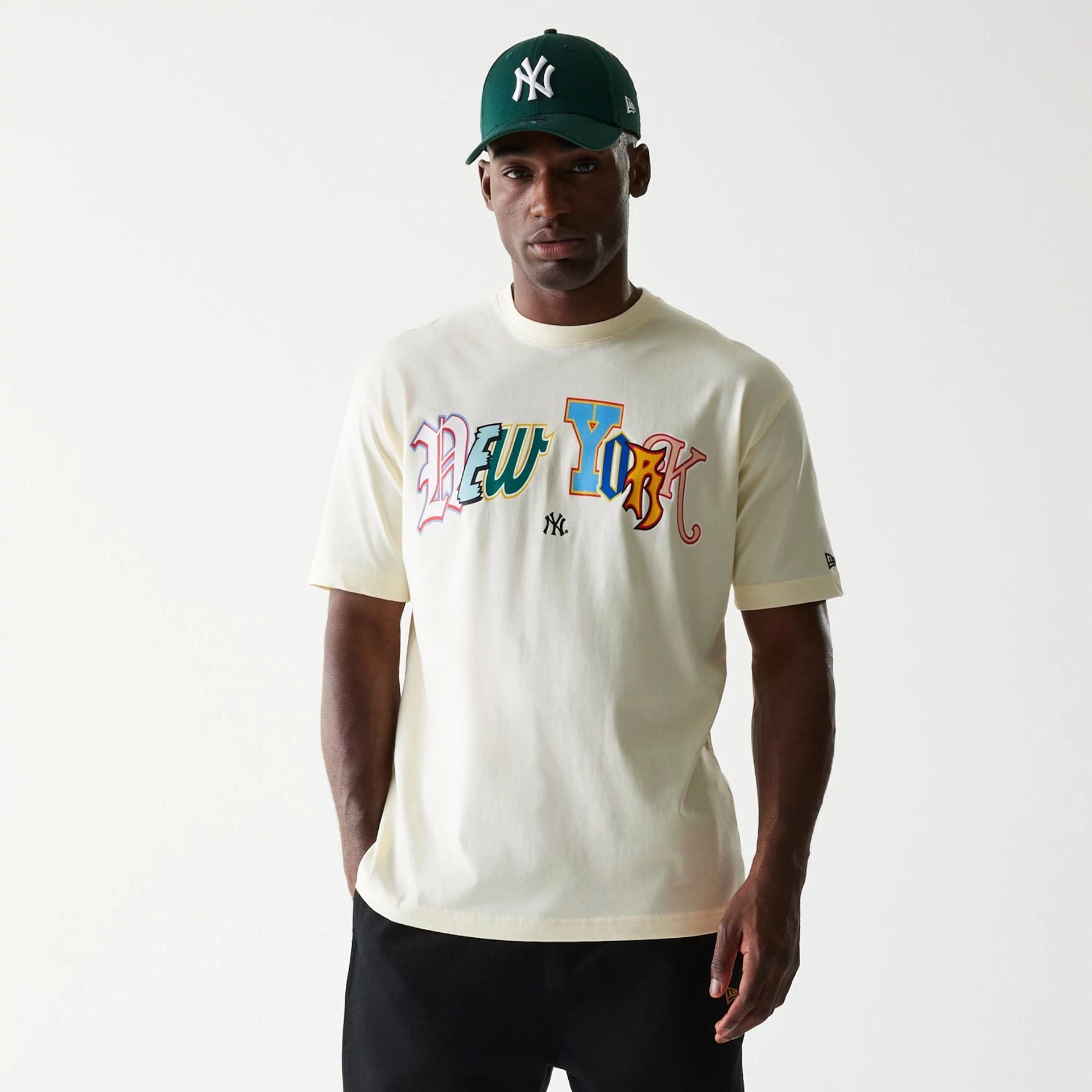 The Male model is wearing New York Yankees Life Graphic Cream T-Shirt 1