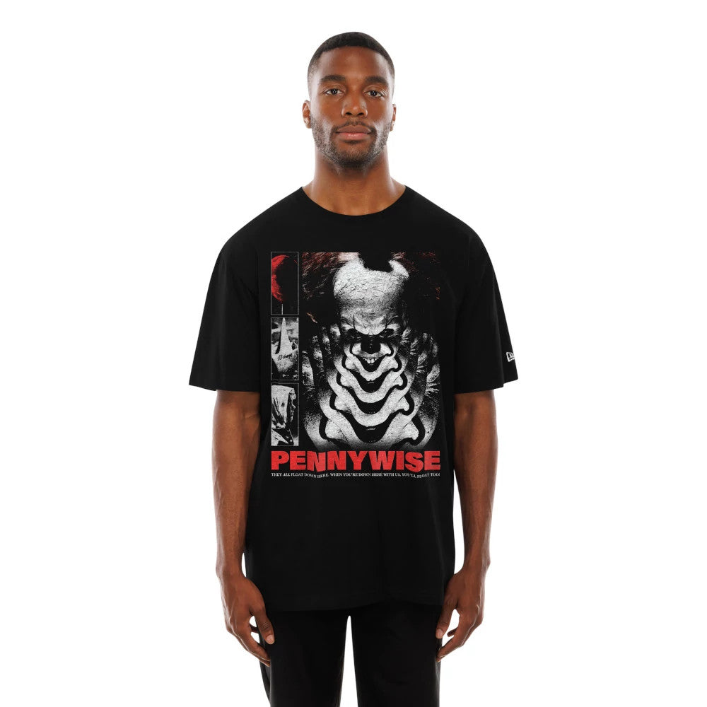 New Era It Life Graphic Black T-Shirt, on-model view showing the large Pennywise graphic with black and white details centred on the chest, red text below, and the New Era logo embroidered on the left sleeve.