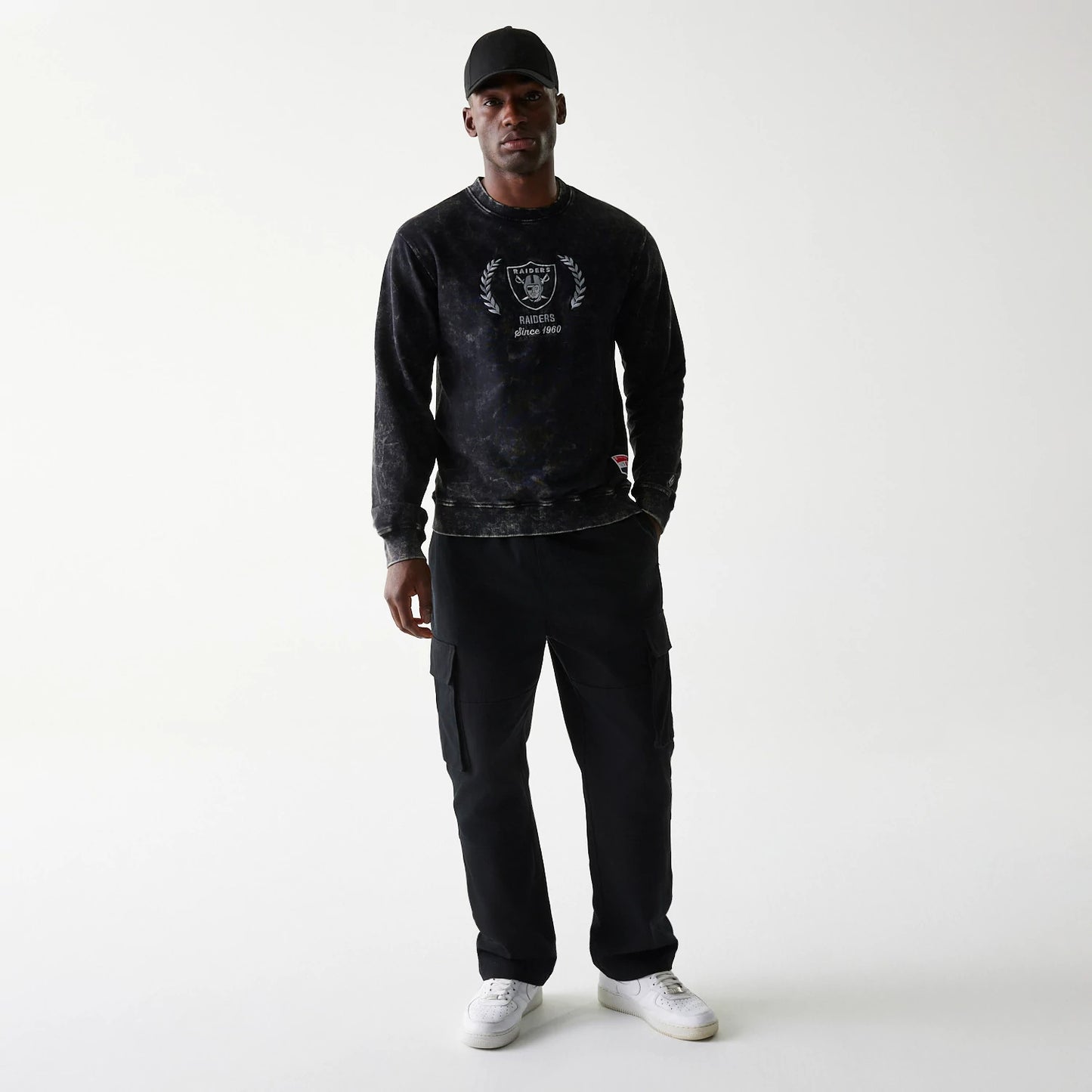 The Male model is wearing Las Vegas Raiders NFL Throwback Black Crew Neck Sweater 6