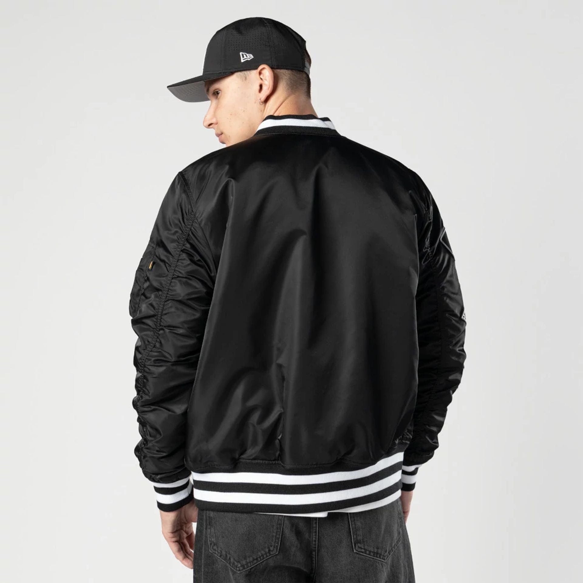 The Male model is wearing Chicago White Sox MLB X Alpha Black Bomber Jacket 2