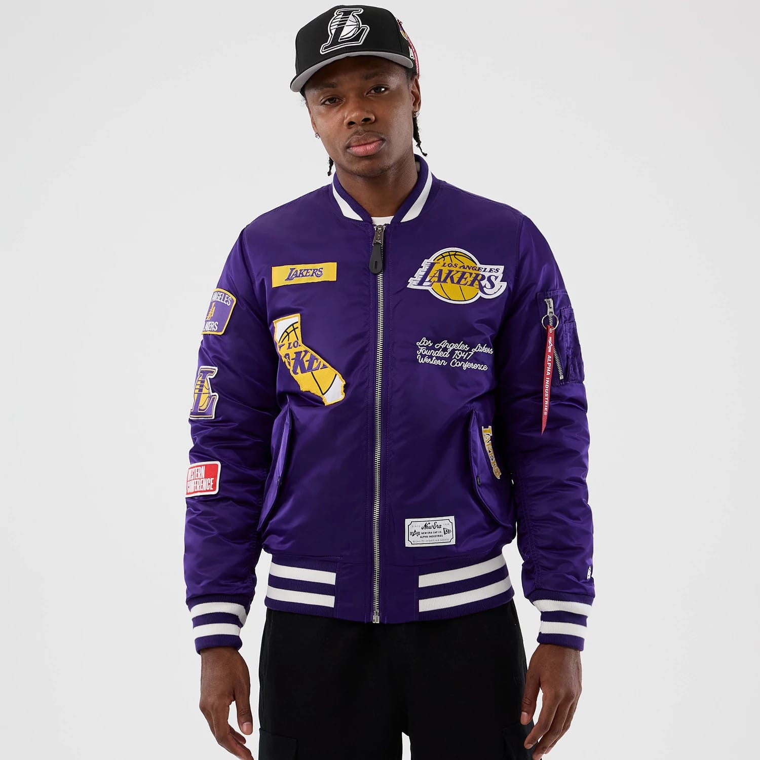 The Male model is wearing LA Lakers NBA x Alpha Purple Jacket 1