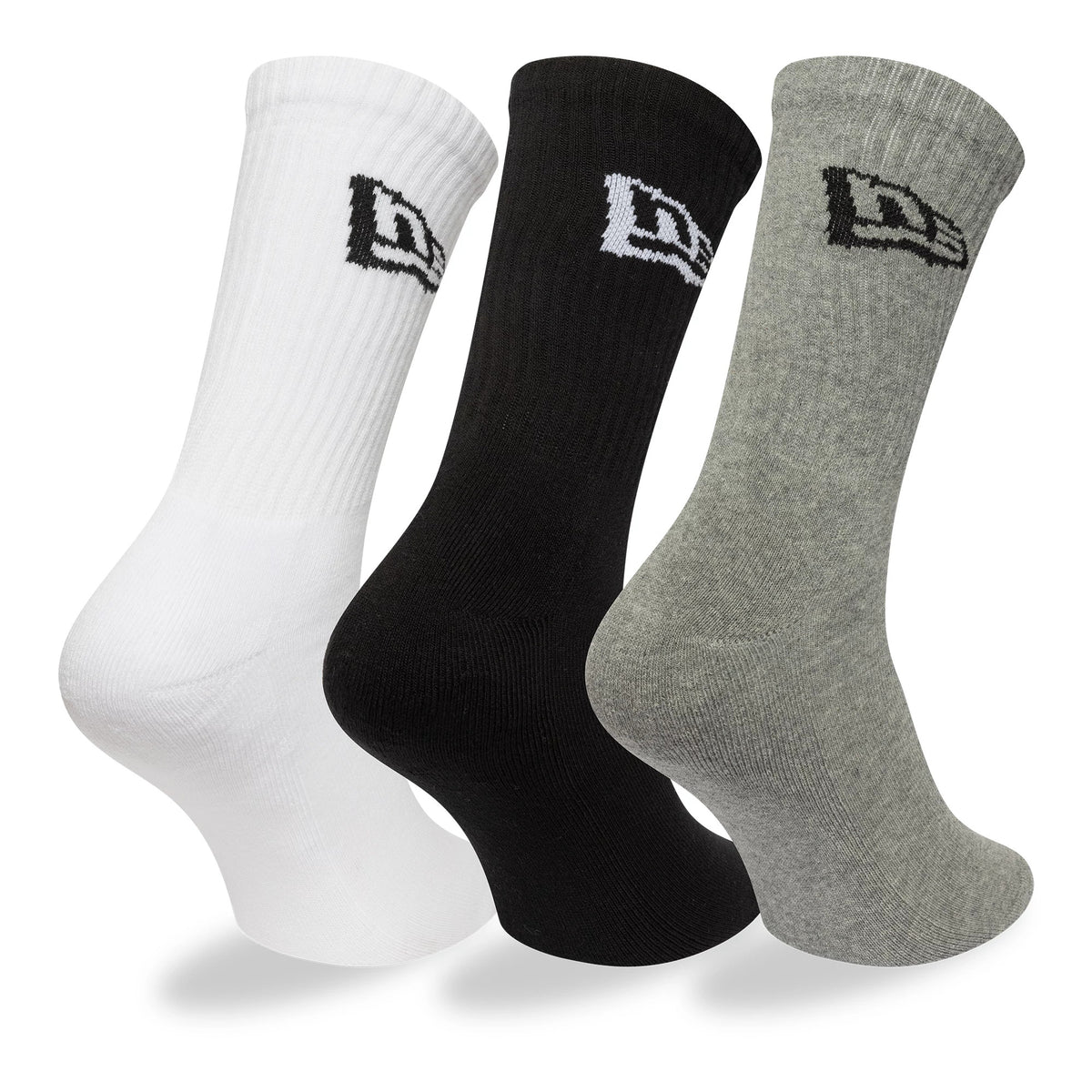 New Era Flag Multi Monochrome 3 Pack Crew Socks, side view showing three ribbed socks in white, black, and grey, each featuring an embroidered New Era logo on the side of the cuff.