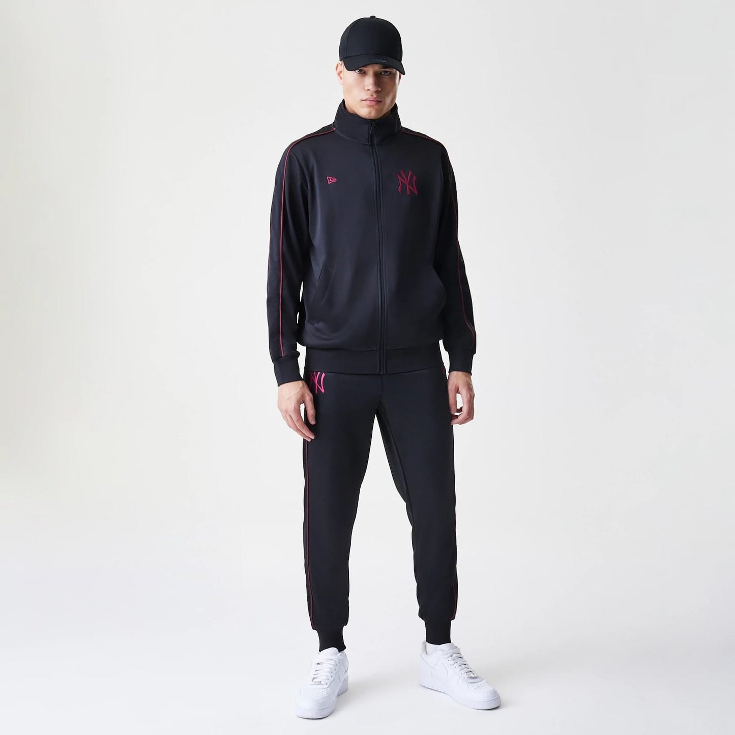 The Male model is wearing New York Yankees MLB Piping Black Track Pants 8