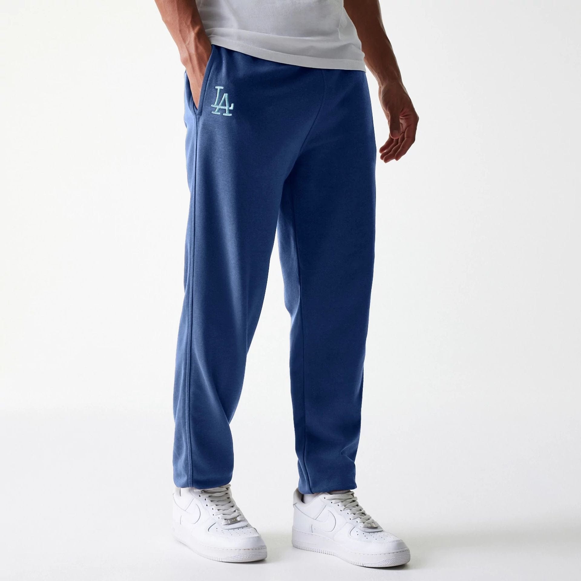 The Male model is wearing LA Dodgers MLB Midi League Essential Blue Joggers 1