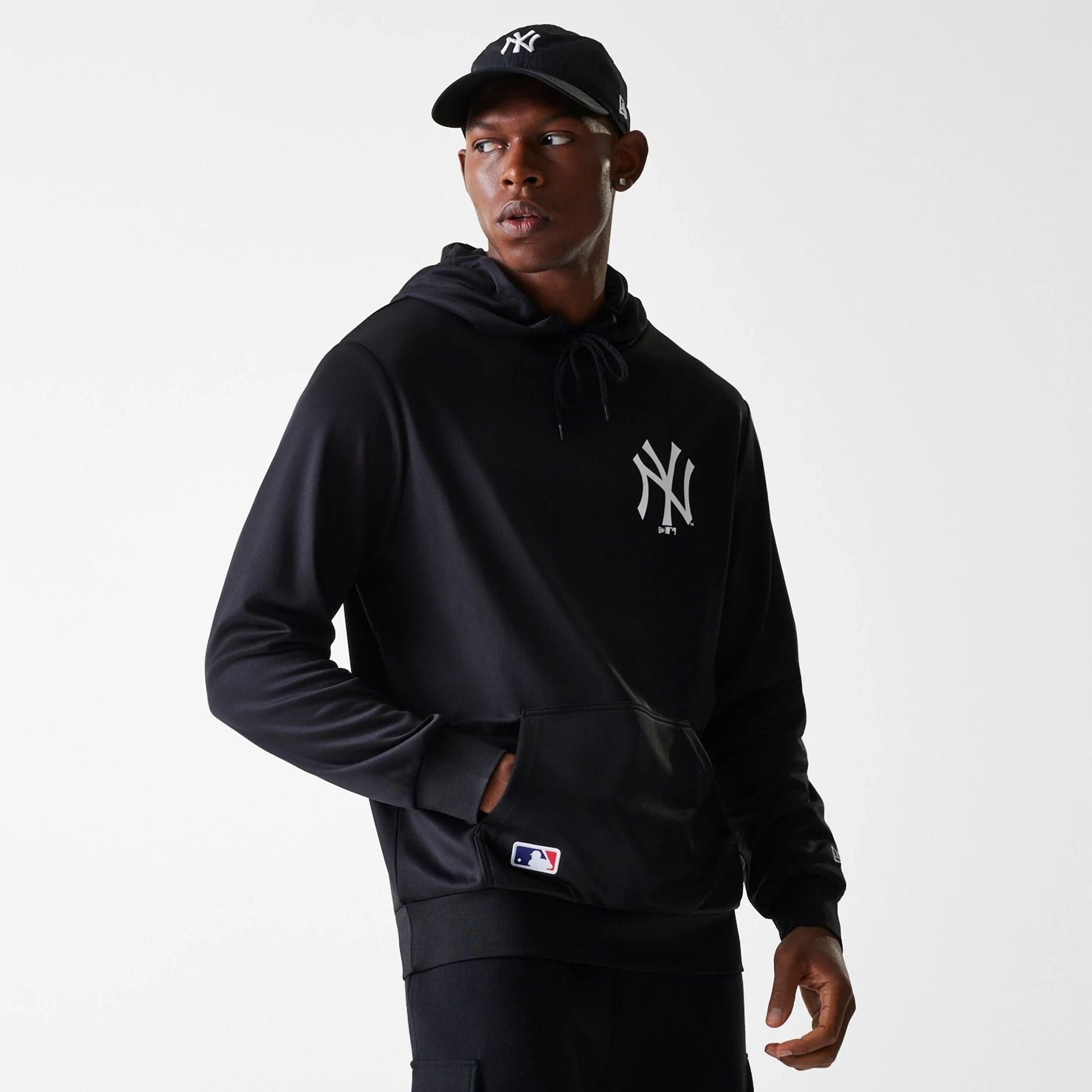 The Male model is wearing New York Yankees MLB Essentials Black Pullover Hoodie 1