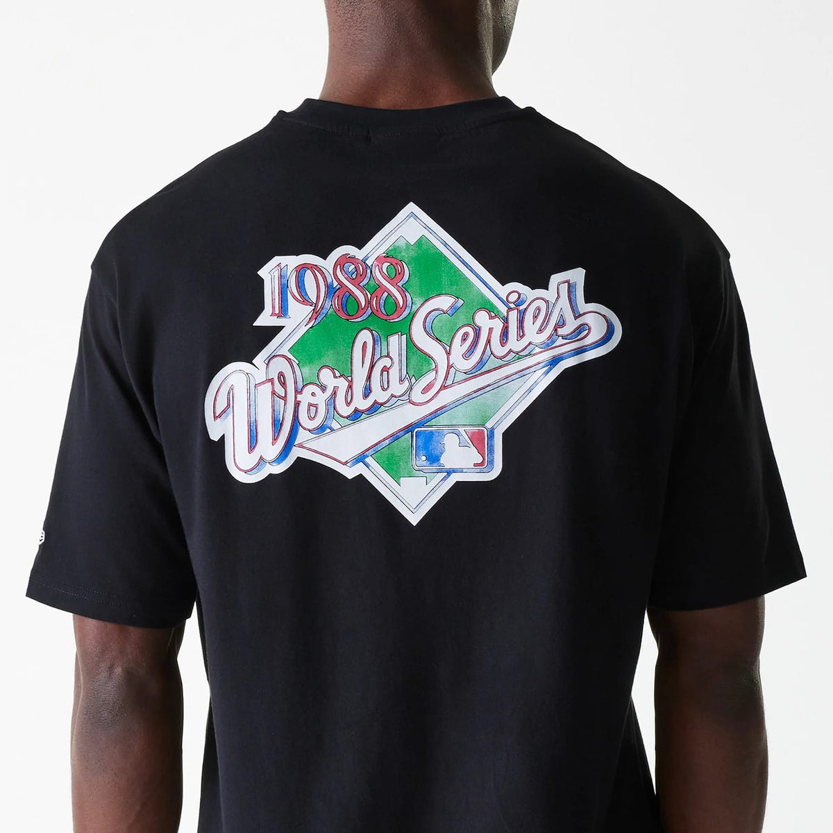 New Era LA Dodgers MLB World Series Black Oversized T-Shirt, rear view featuring a large colourful 1988 World Series graphic centred on the back, with the MLB logo at the bottom of the design and a small logo on the sleeve.