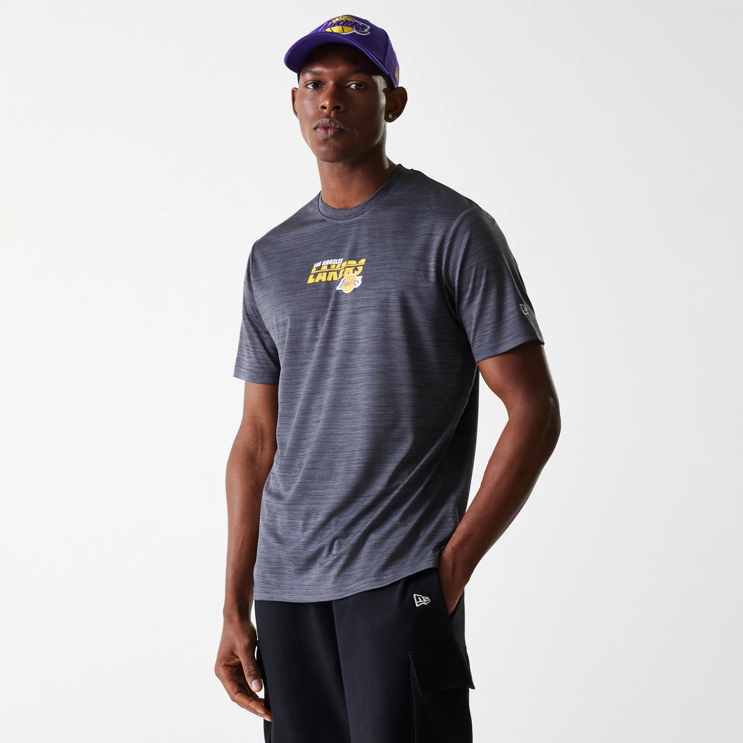 The Male model is wearing LA Lakers NBA Essentials Black T-Shirt 1