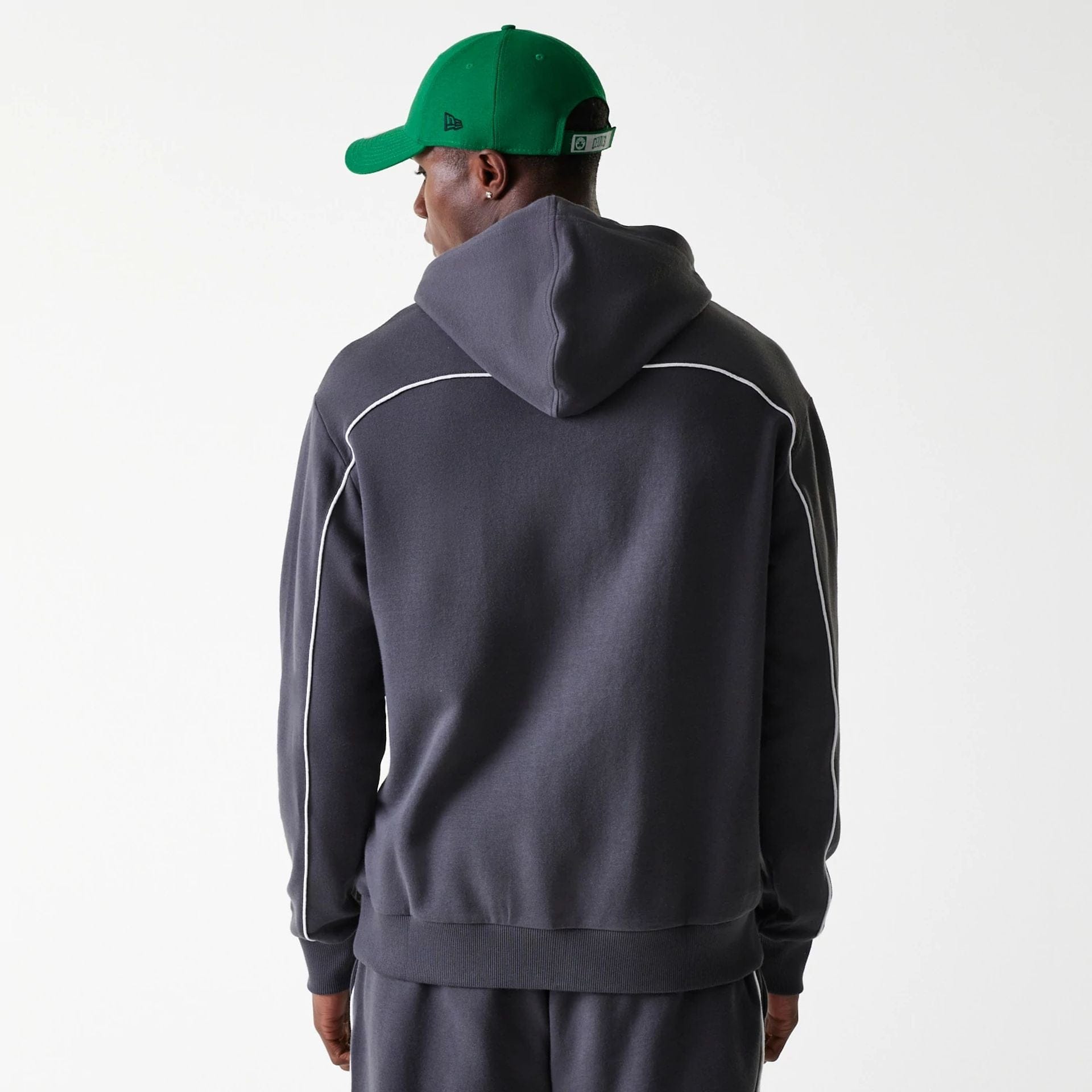 The Male model is wearing Boston Celtics NBA Piping Dark Grey Oversized Pullover Hoodie 2