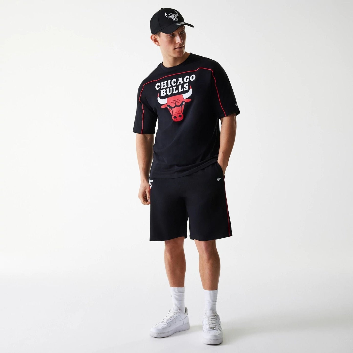The Male model is wearing Chicago Bulls NBA Piping Black Shorts 8