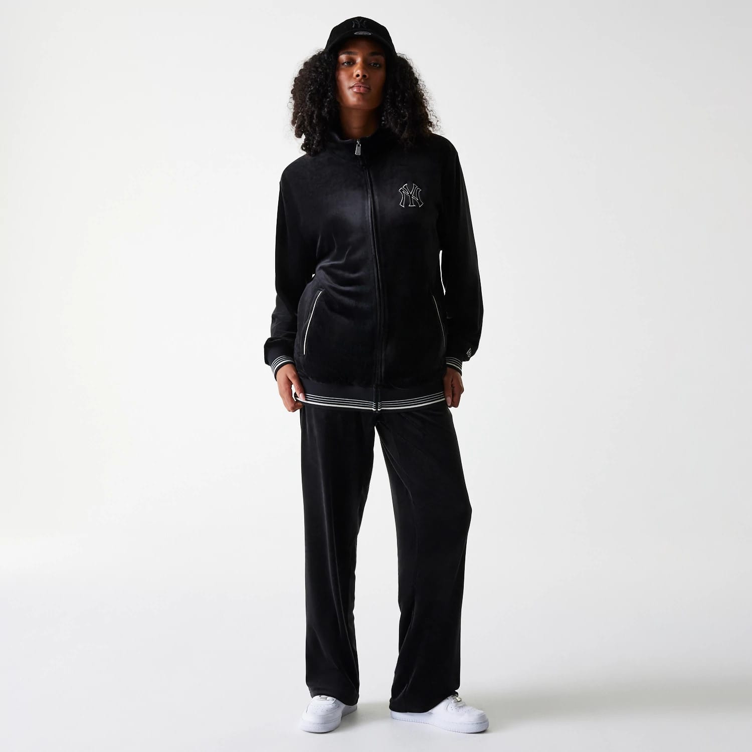 The Male model is wearing New York Yankees MLB Velour Black Track Pants 4