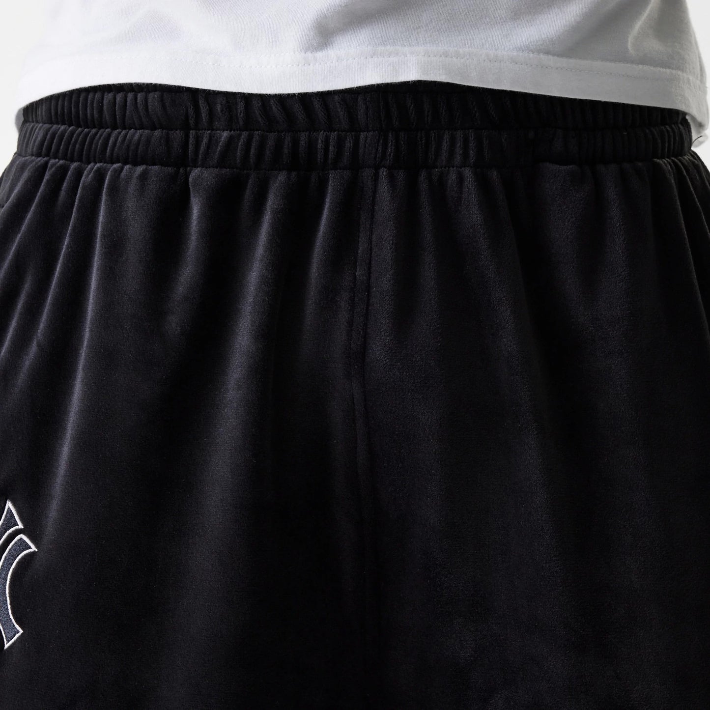 The Male model is wearing New York Yankees MLB Velour Black Track Pants 8