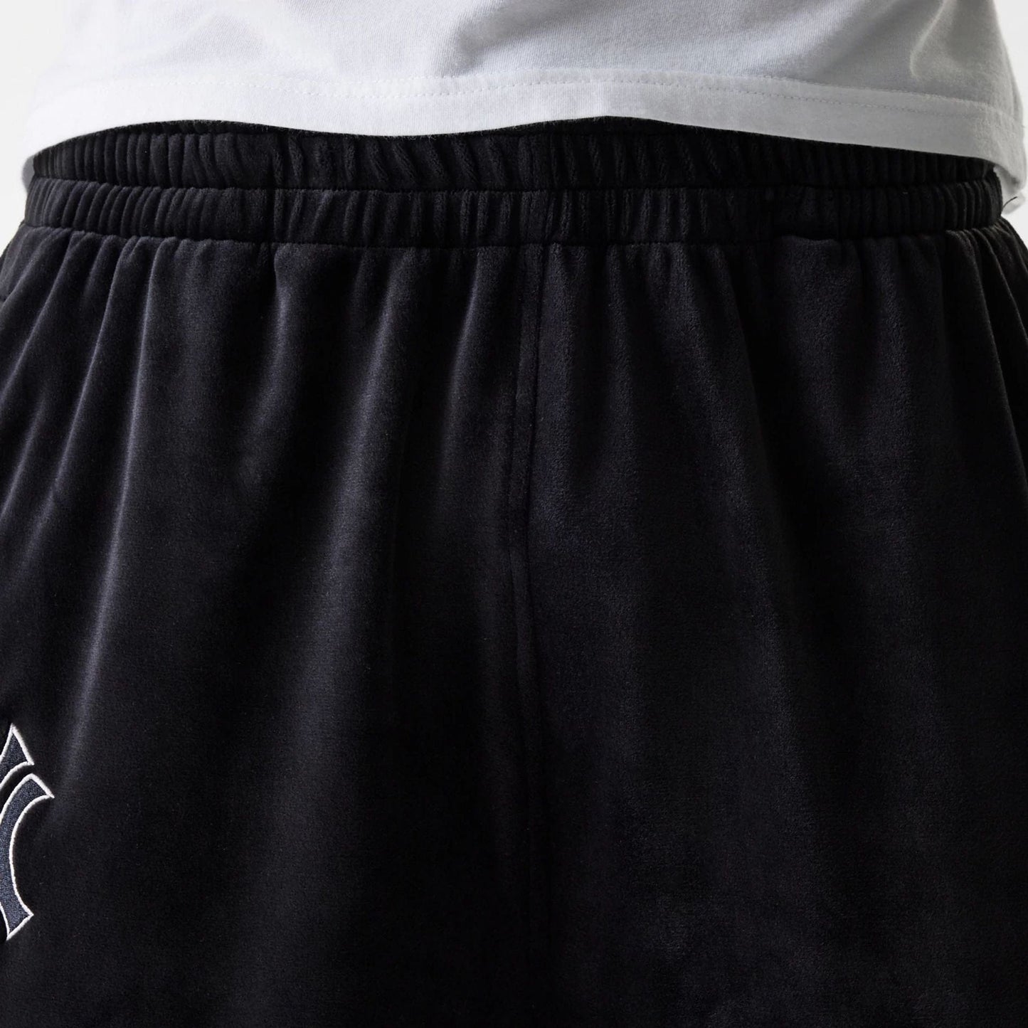 The Male model is wearing New York Yankees MLB Velour Black Track Pants 8