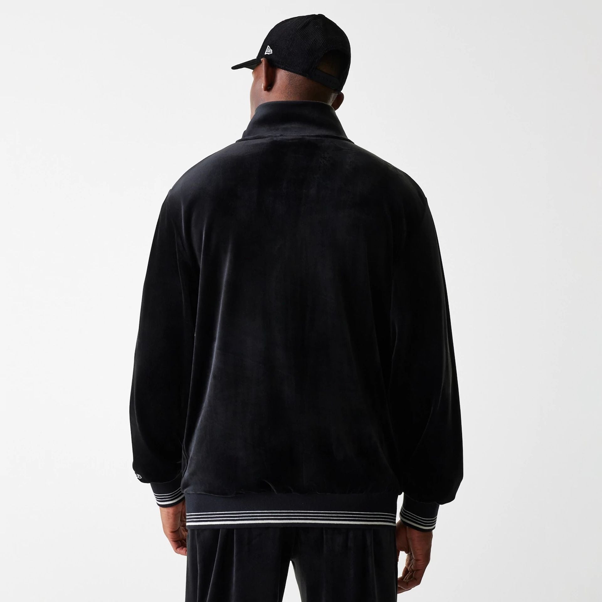 The Male model is wearing New York Yankees MLB Velour Black Track Top 2