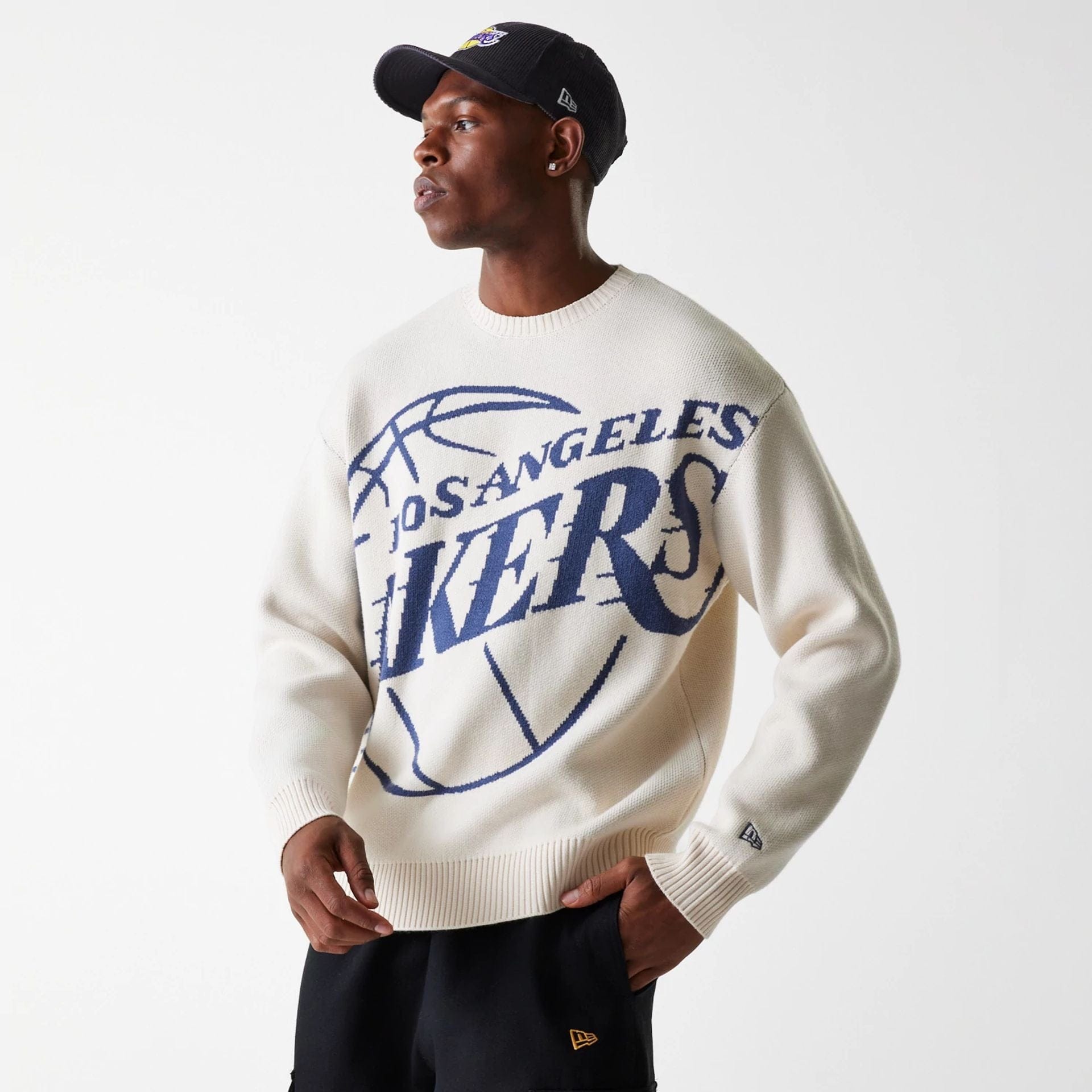 The Male model is wearing LA Lakers NBA Knit Light Beige Oversized Knit Sweater 2