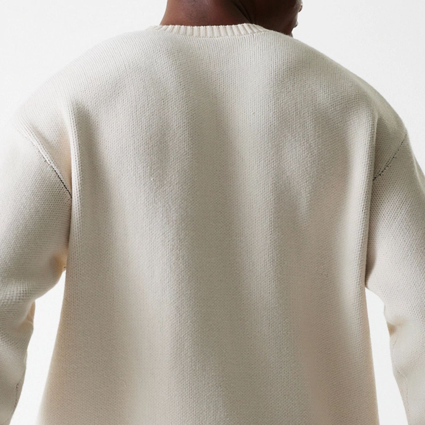 The Male model is wearing LA Lakers NBA Knit Light Beige Oversized Knit Sweater 8