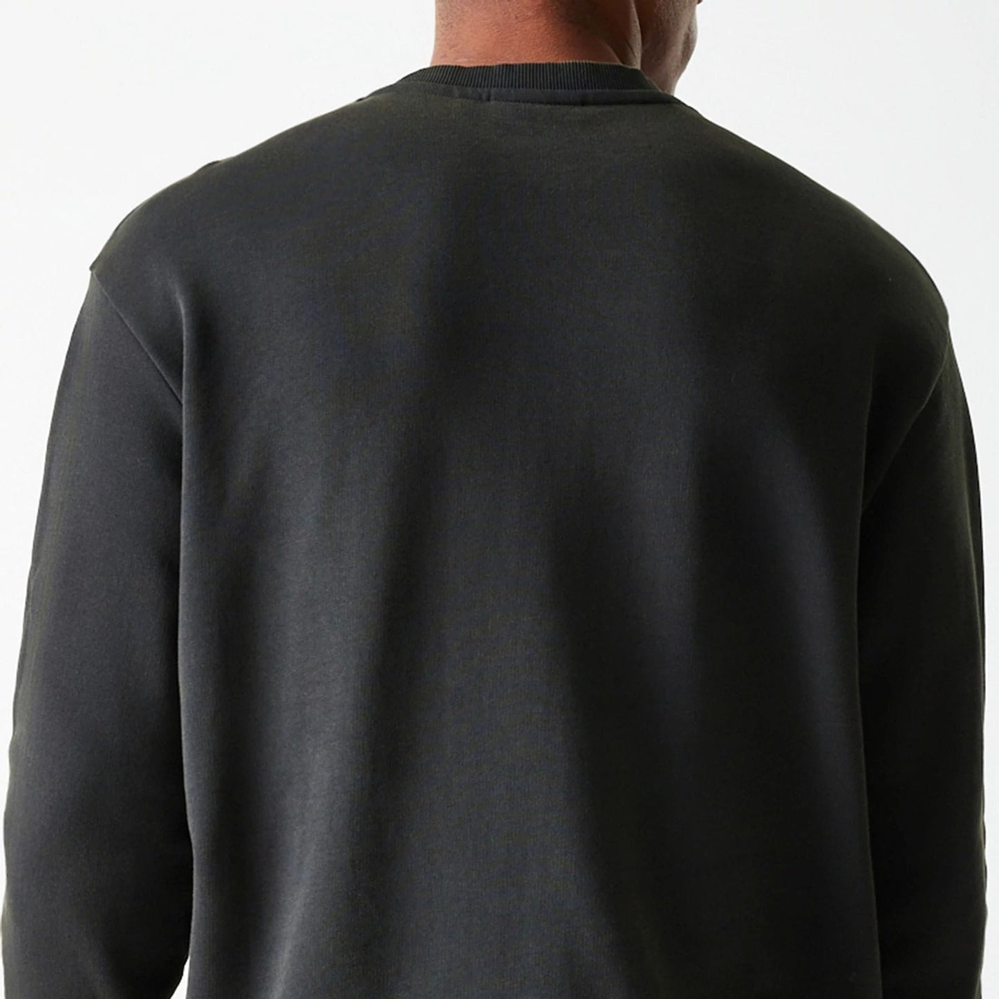 New Era Las Vegas Raiders NFL Washed Super Bowl Grey Oversized Crew Neck Sweater, back view on a model highlighting the relaxed fit and simple crew neck design, without any graphic elements visible.