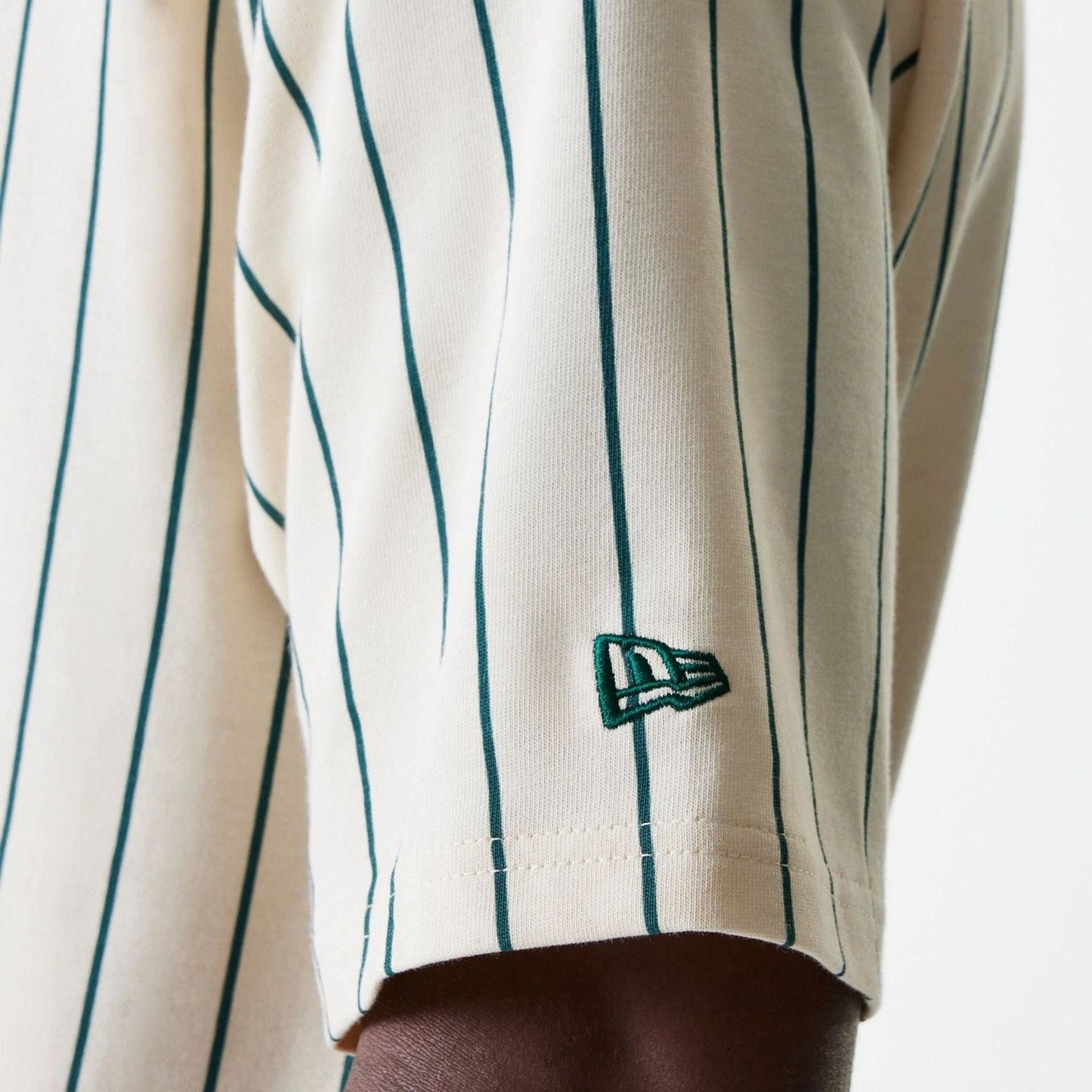 The Male model is wearing New Era Pinstripe Light Beige Oversized T-Shirt 7