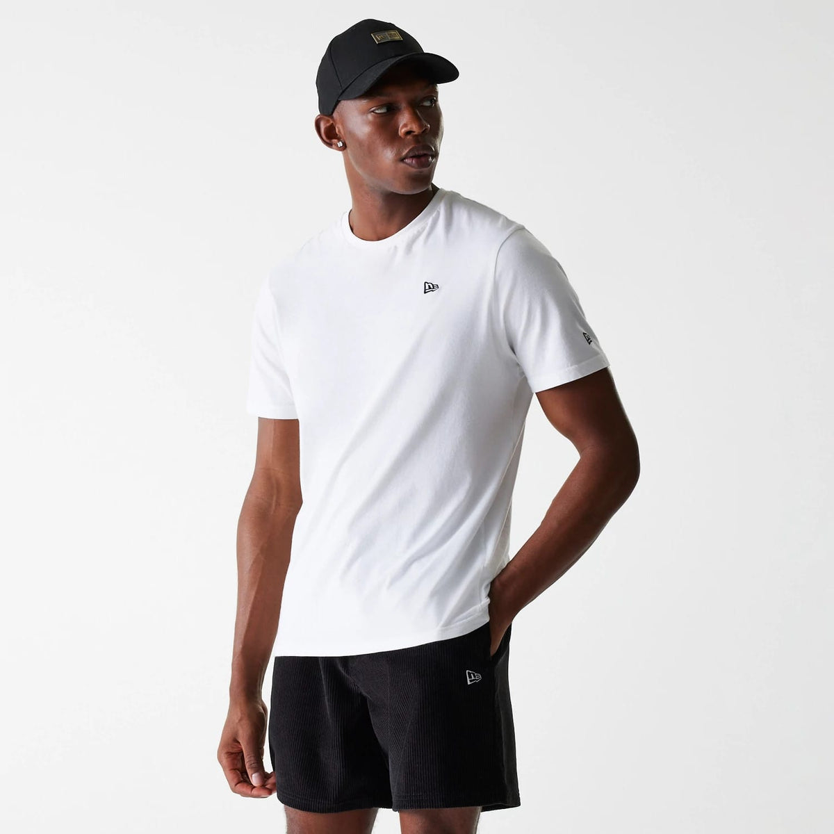 The Male model is wearing New Era Cord Black Shorts 4