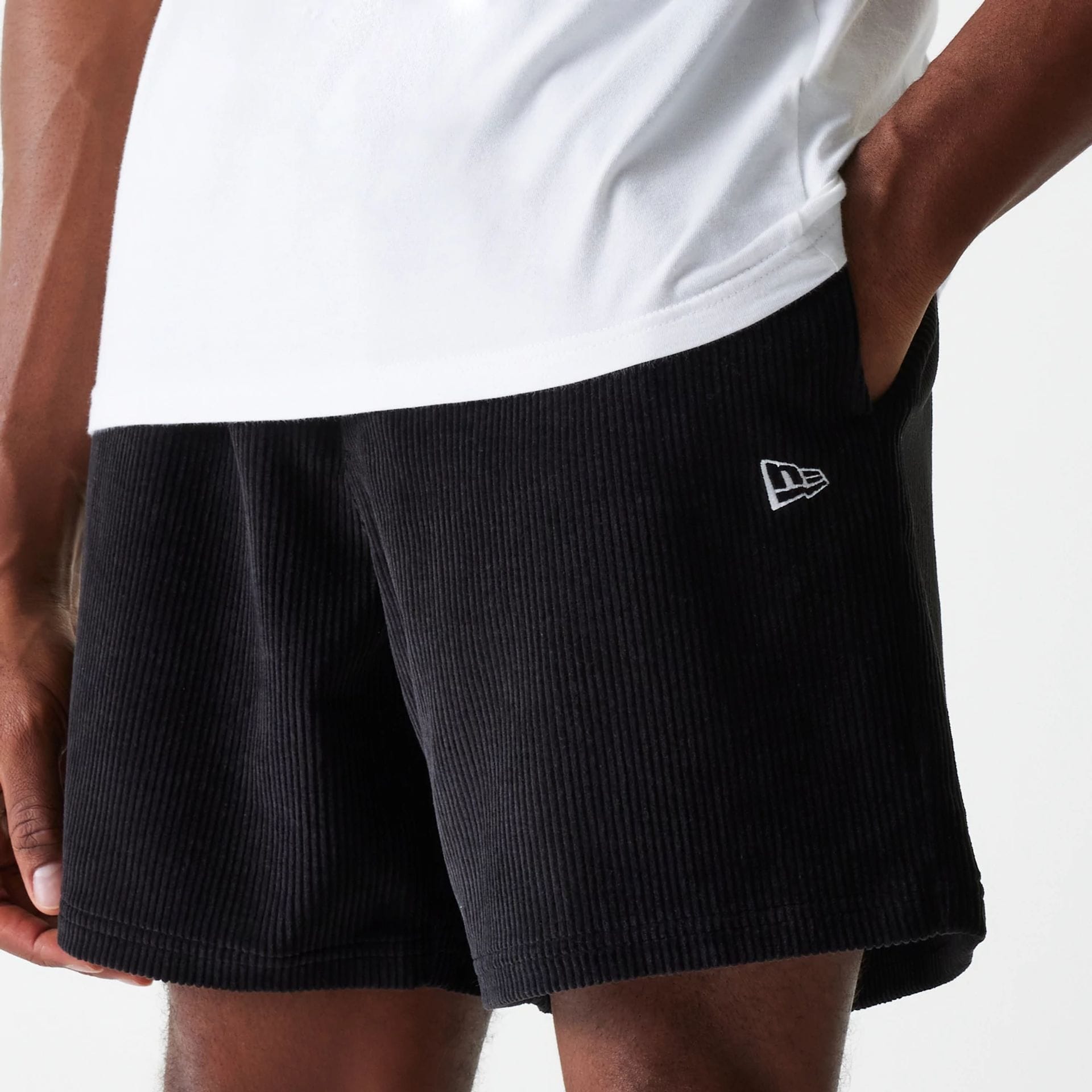 The Male model is wearing New Era Cord Black Shorts 1
