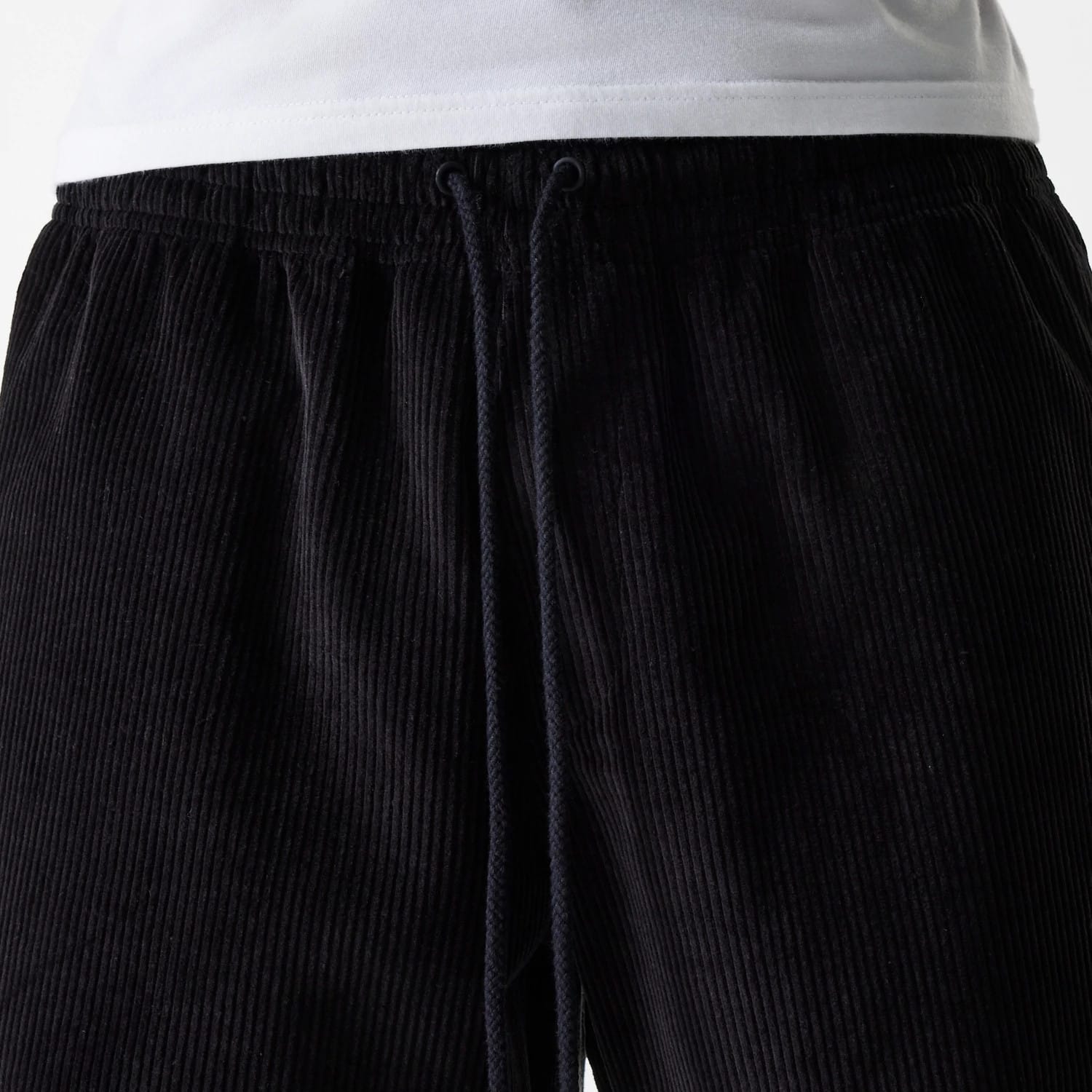 The Male model is wearing New Era Cord Black Shorts 3