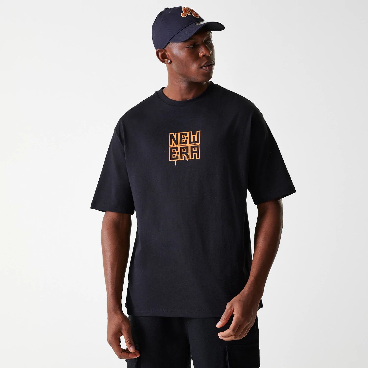The Male model is wearing New Era Graffiti Graphic Black Oversized T-Shirt 3