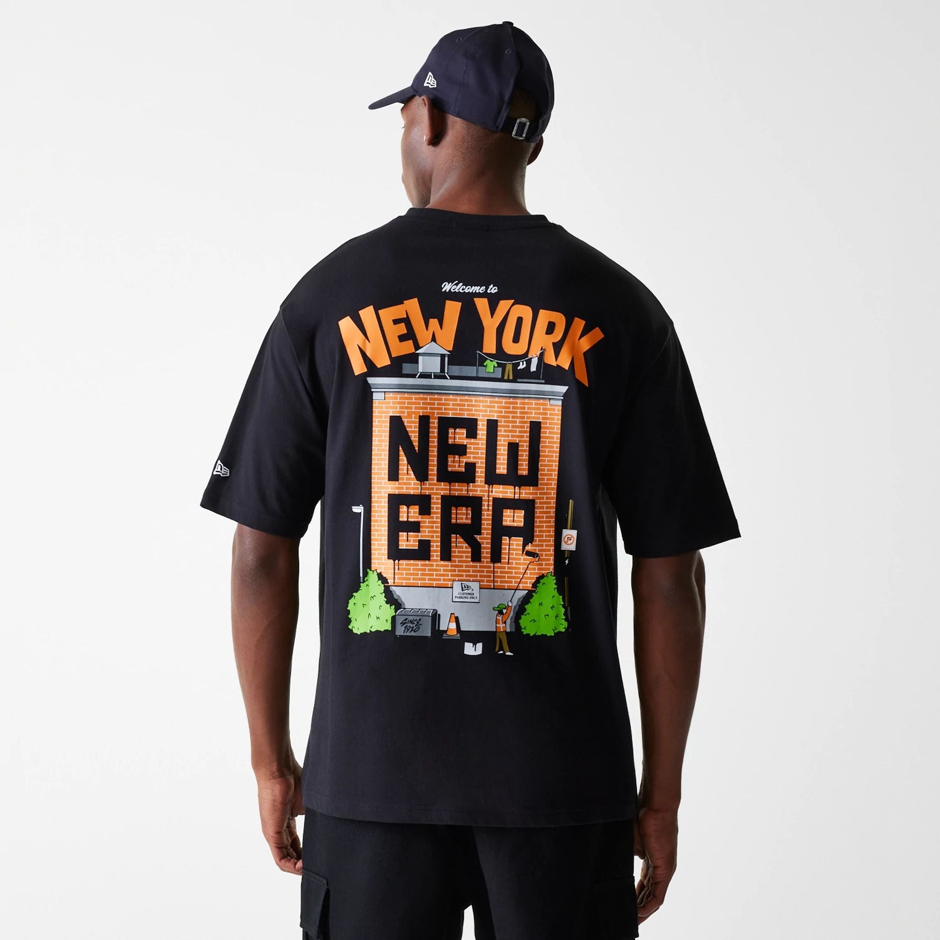 The Male model is wearing New Era Graffiti Graphic Black Oversized T-Shirt 2