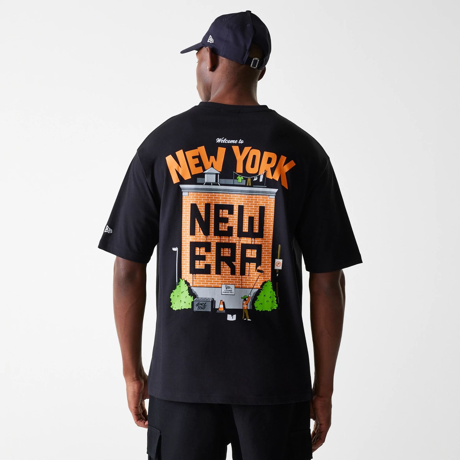 The Male model is wearing New Era Graffiti Graphic Black Oversized T-Shirt 2