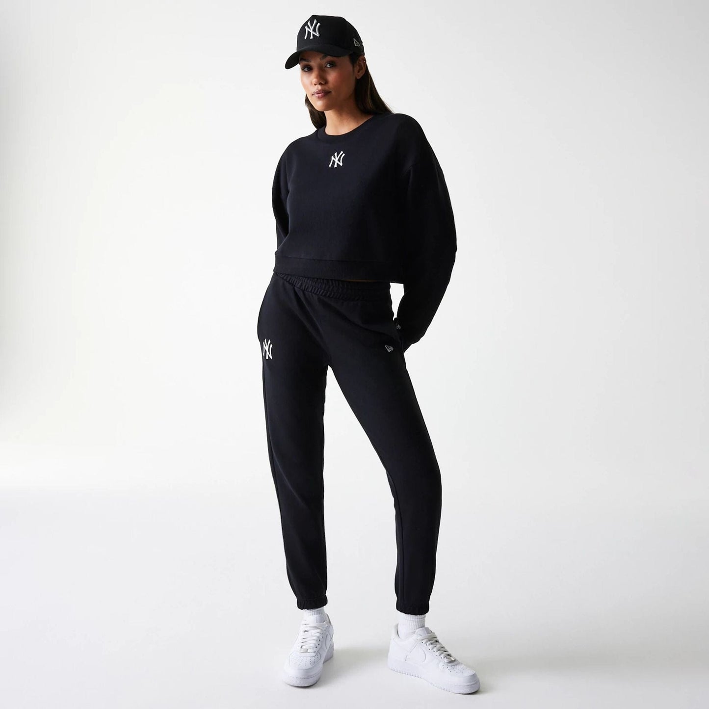 The Female model is wearing New York Yankees Womens MLB Midi League Essential Black Cropped Crew Neck Sweater 8